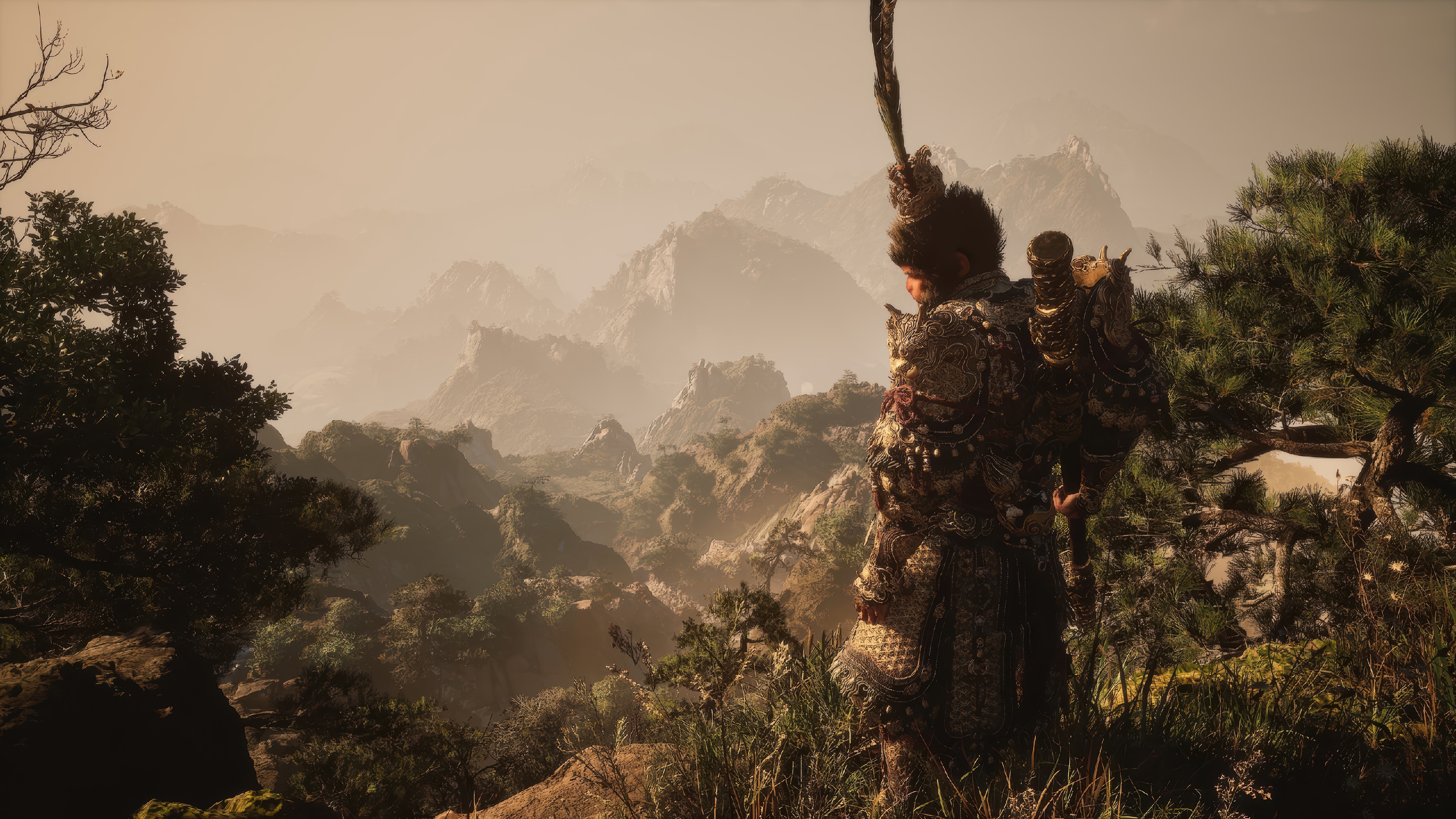 Wukong stands on a mountain overlooking a misty landscape HD Wallpaper
