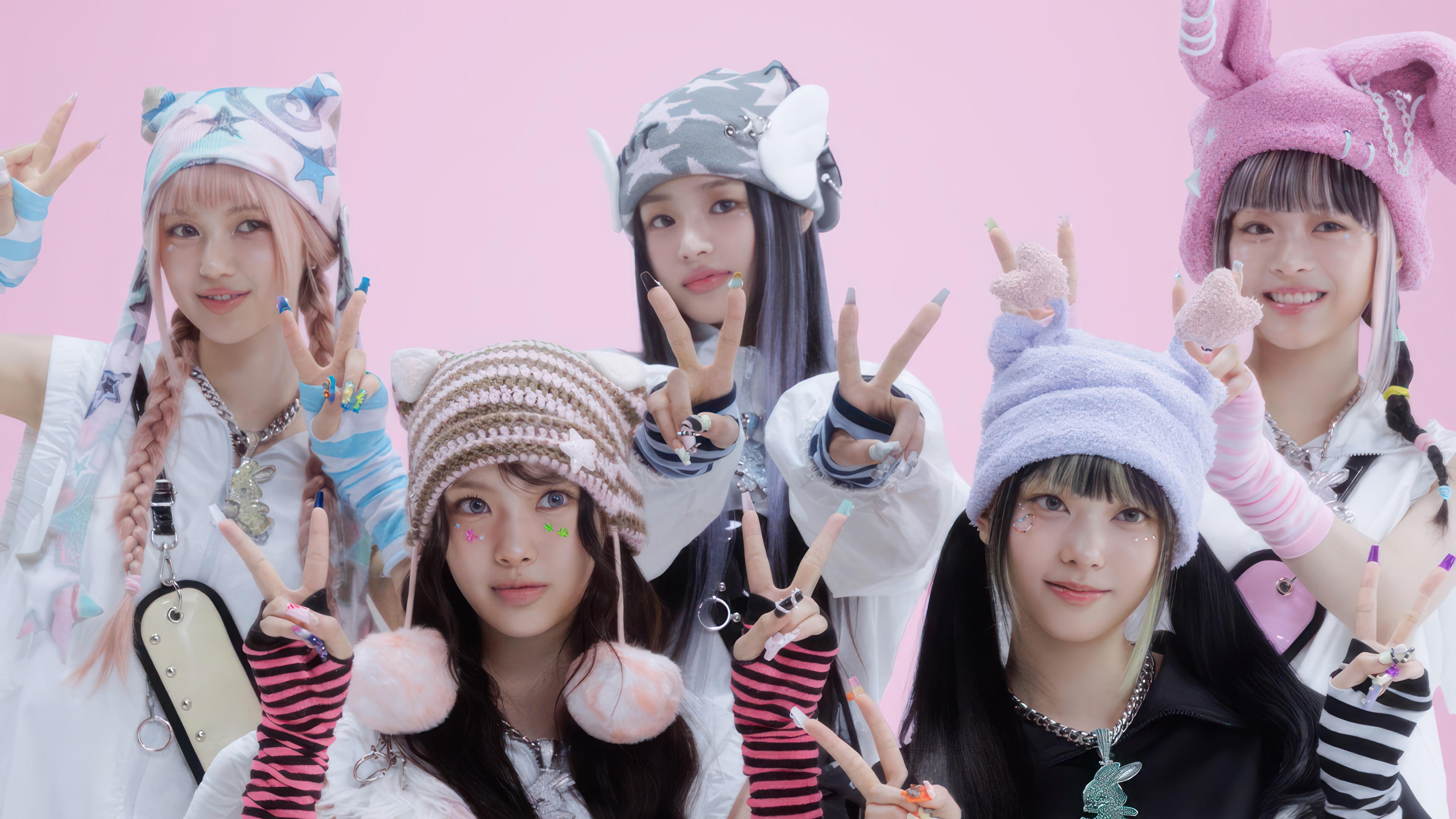 NewJeans members posing with peace signs HD Wallpaper