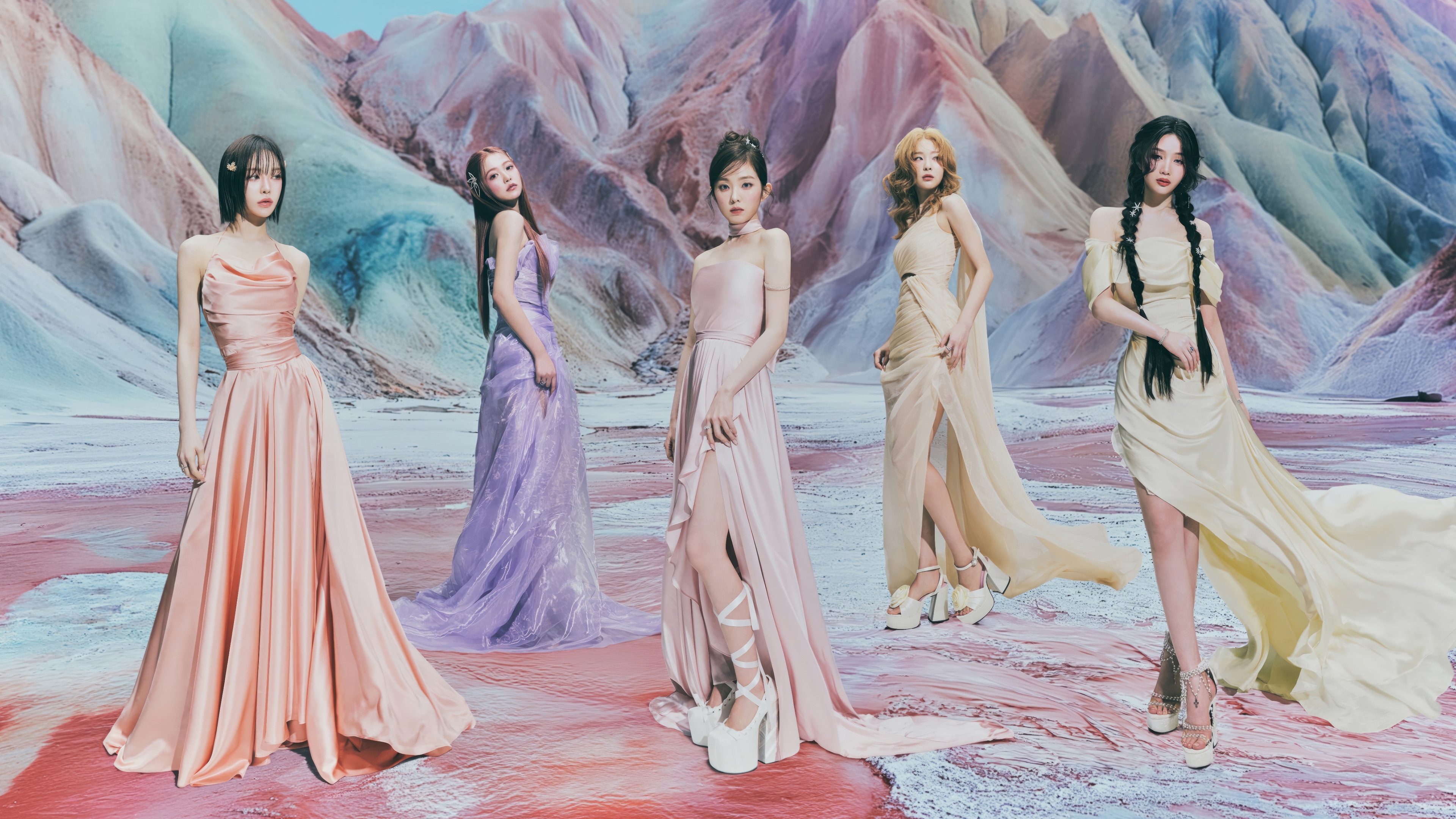 Red Velvet members in ethereal gowns on a colorful landscape HD Wallpaper