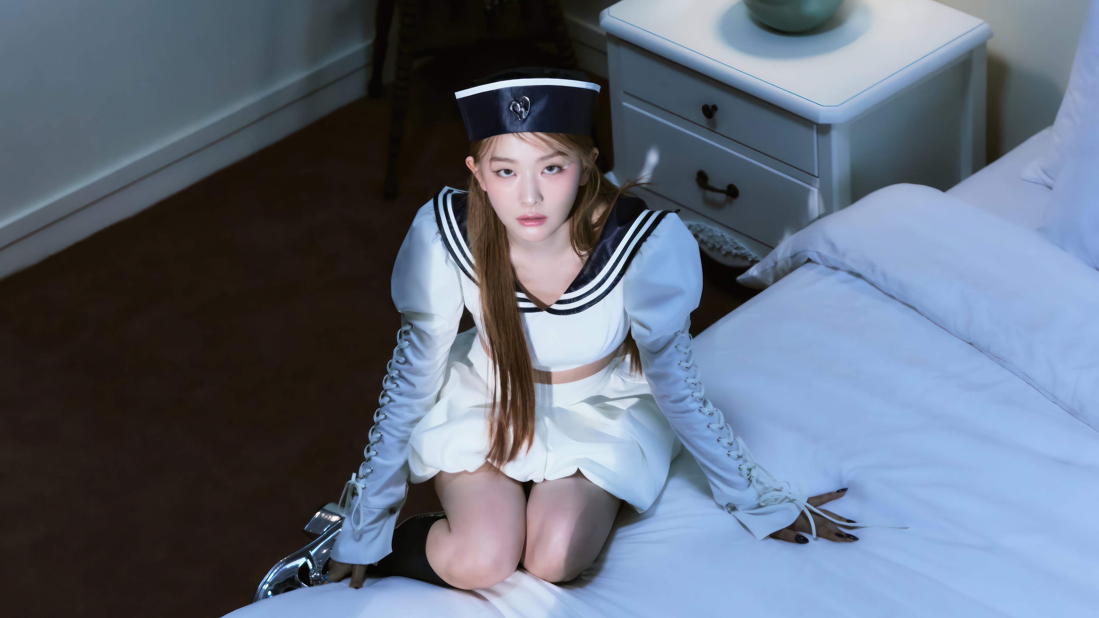 Seulgi in a sailor outfit on a bed HD Wallpaper