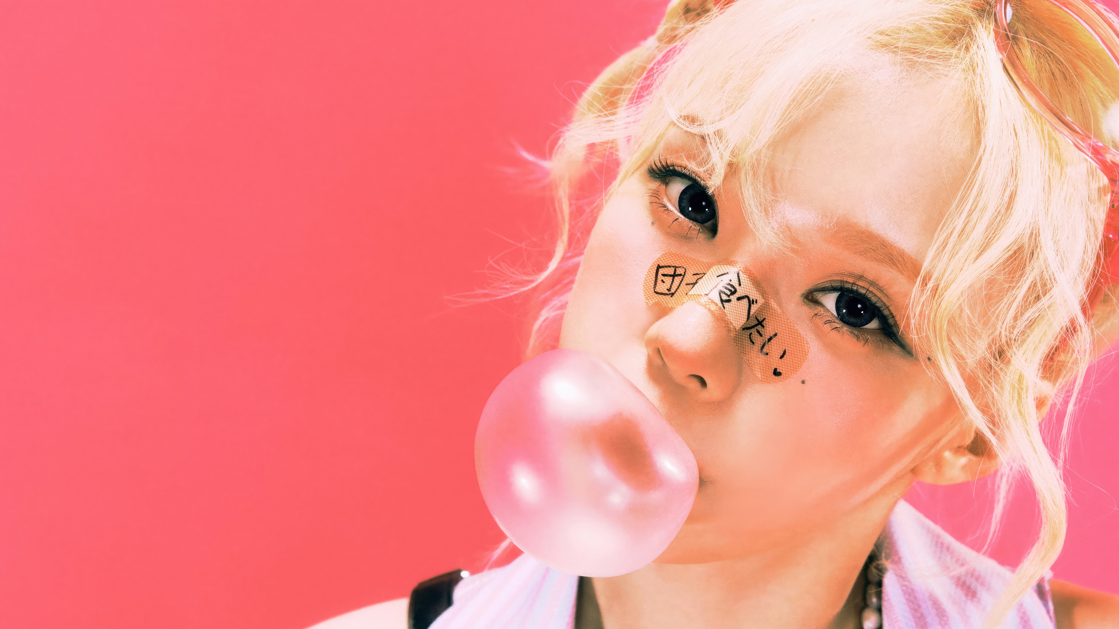 Aespa Winter blowing bubble gum with bandages on face HD Wallpaper