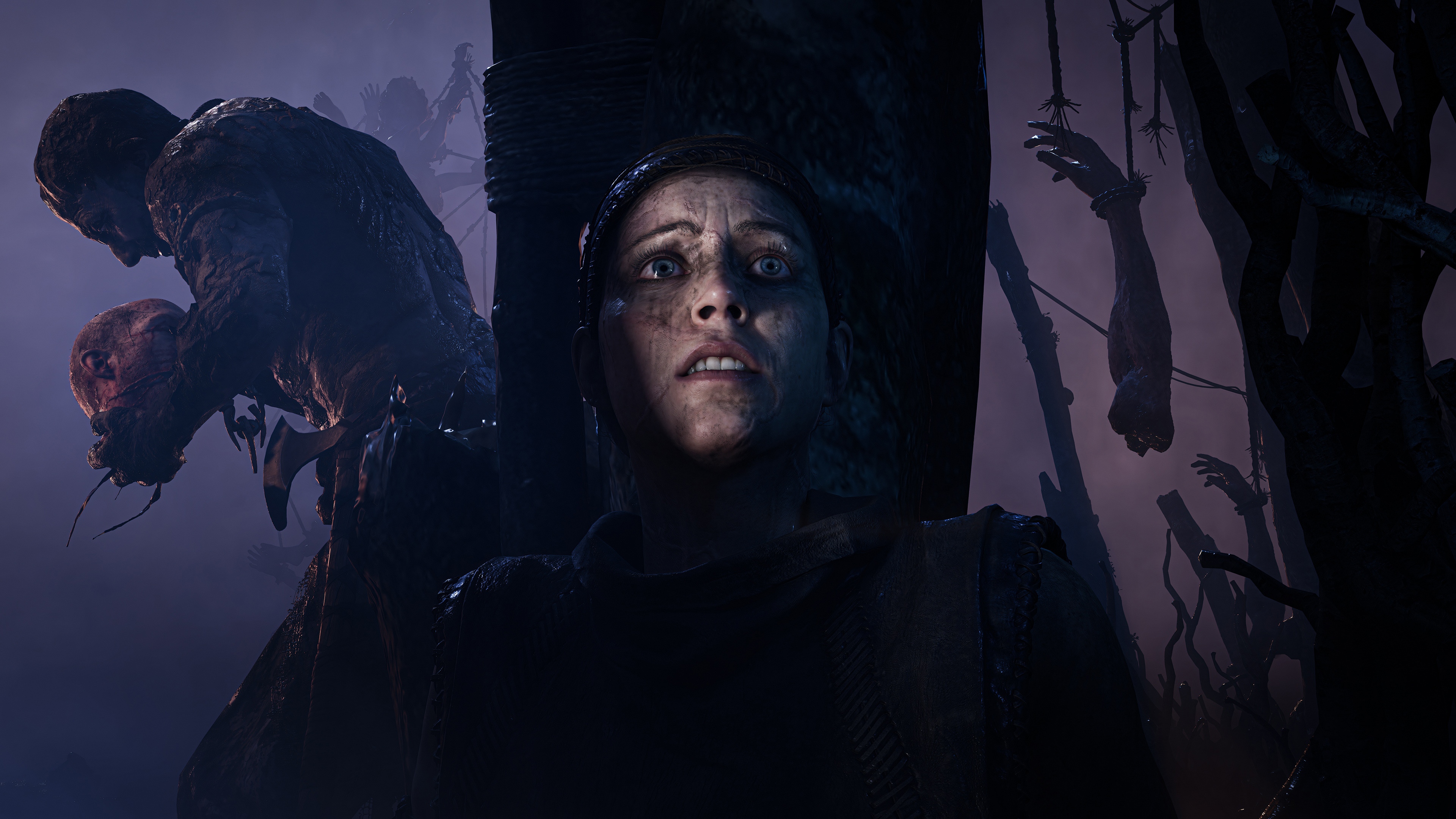 A woman looks up in horror at monstrous figures and hanging bodies HD Wallpaper
