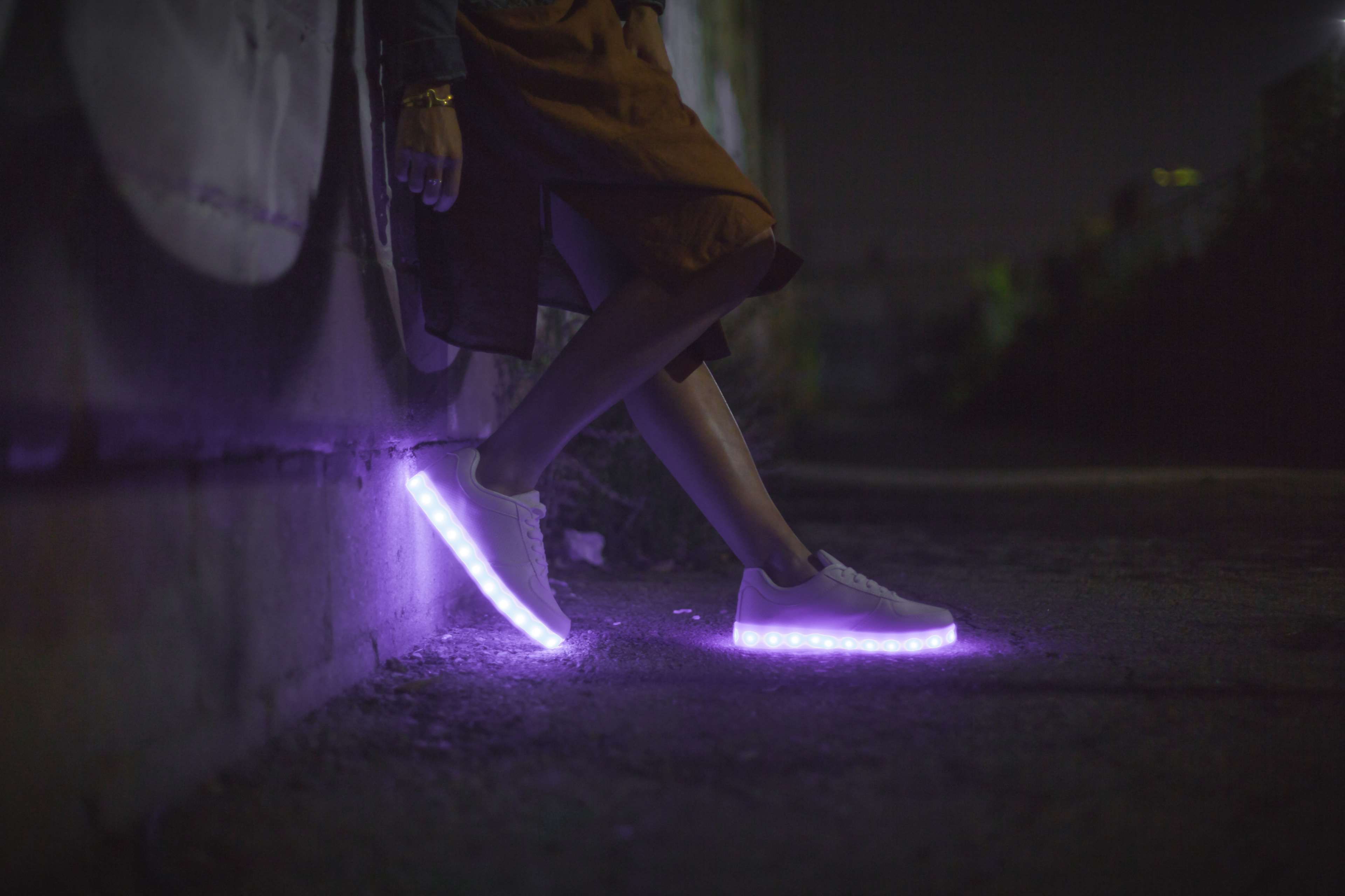 Person wearing light-up sneakers at night HD Wallpaper