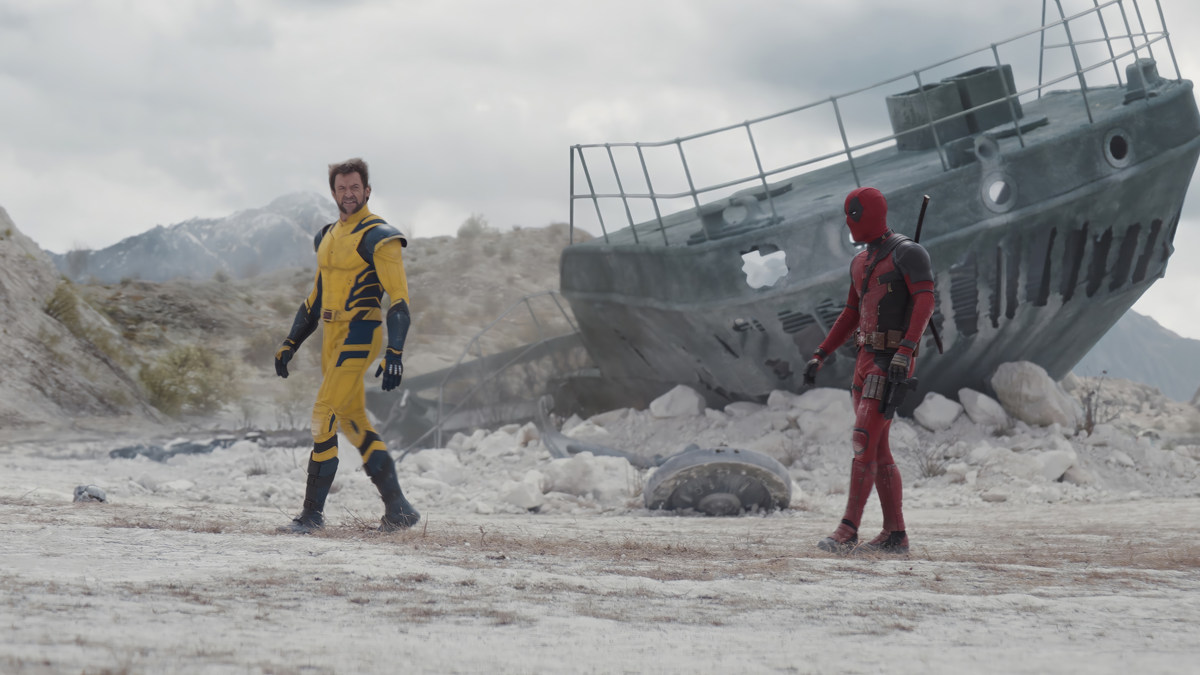 Deadpool and Wolverine in a desert landscape HD Wallpaper