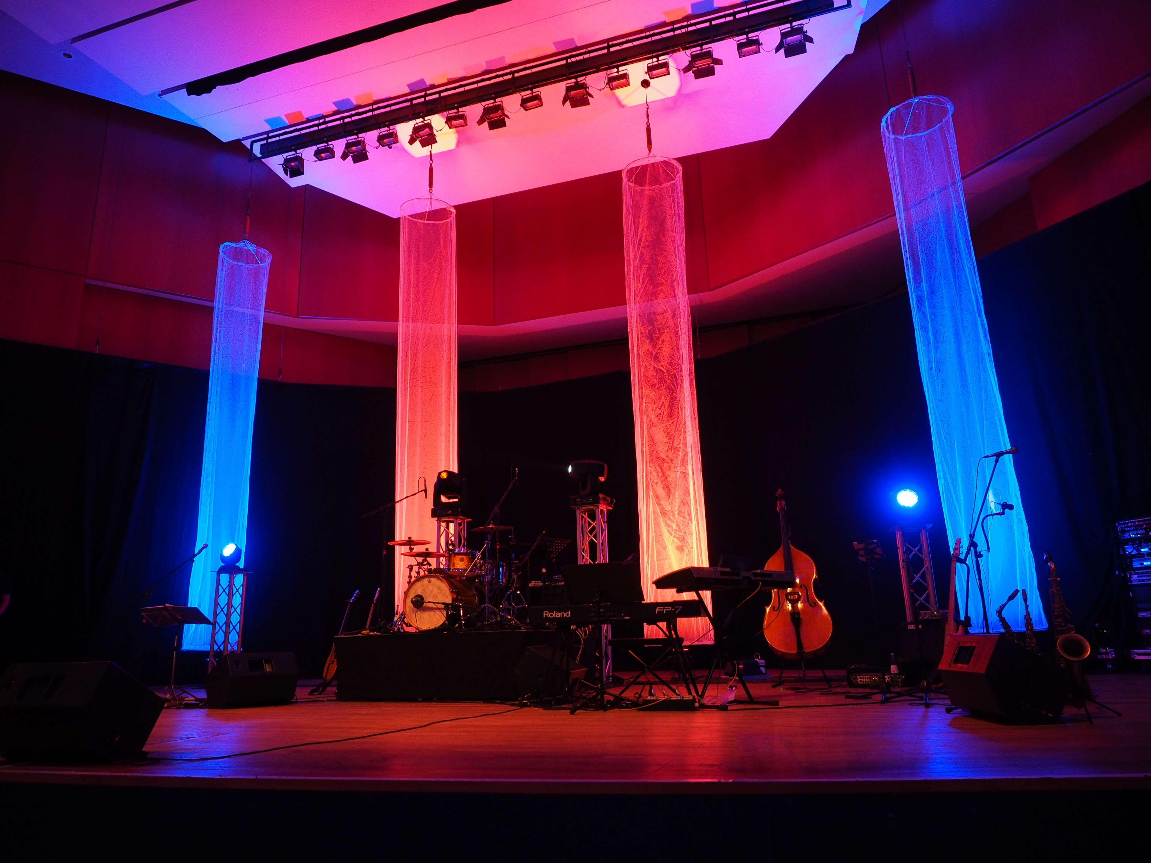 Concert stage with musical instruments and lighting HD Wallpaper