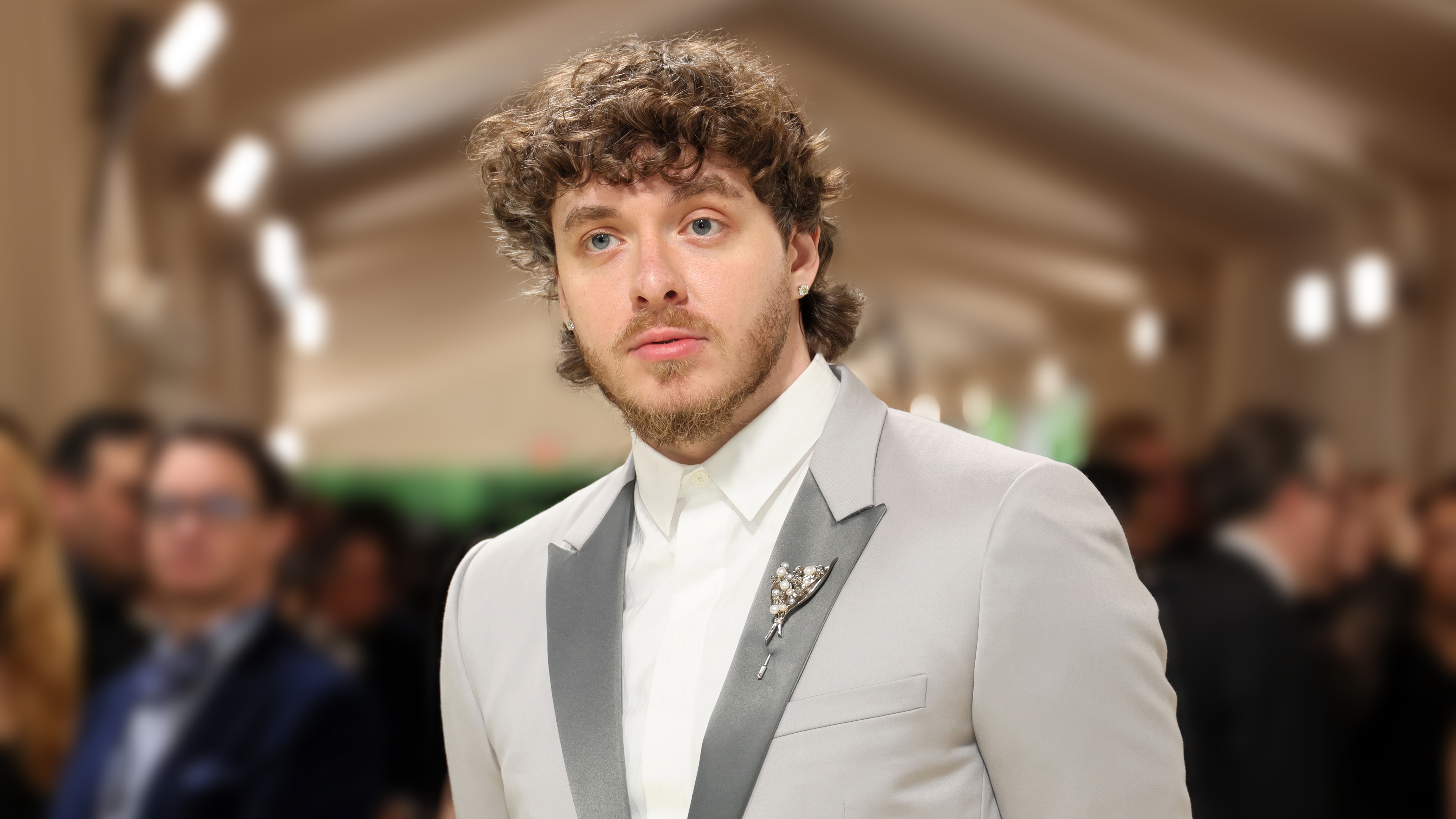 Jack Harlow in a light grey suit with a brooch HD Wallpaper