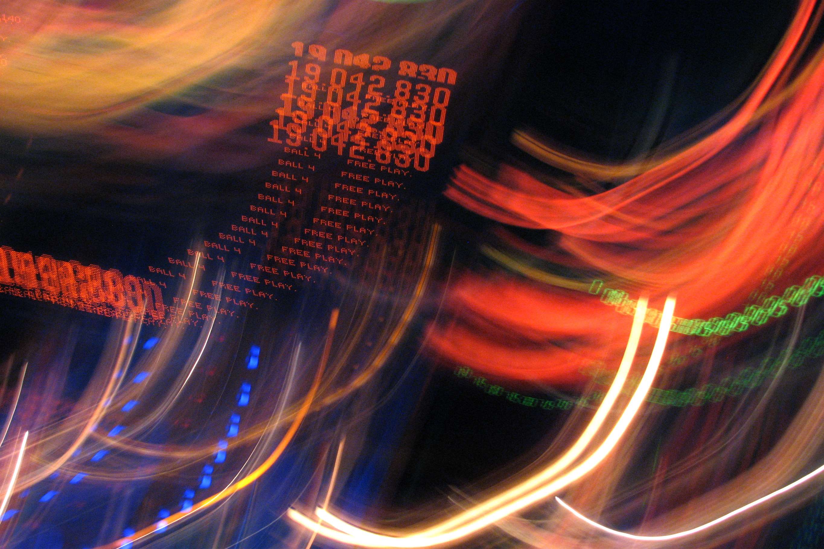 Abstract motion blur of pinball machine lights and numbers HD Wallpaper