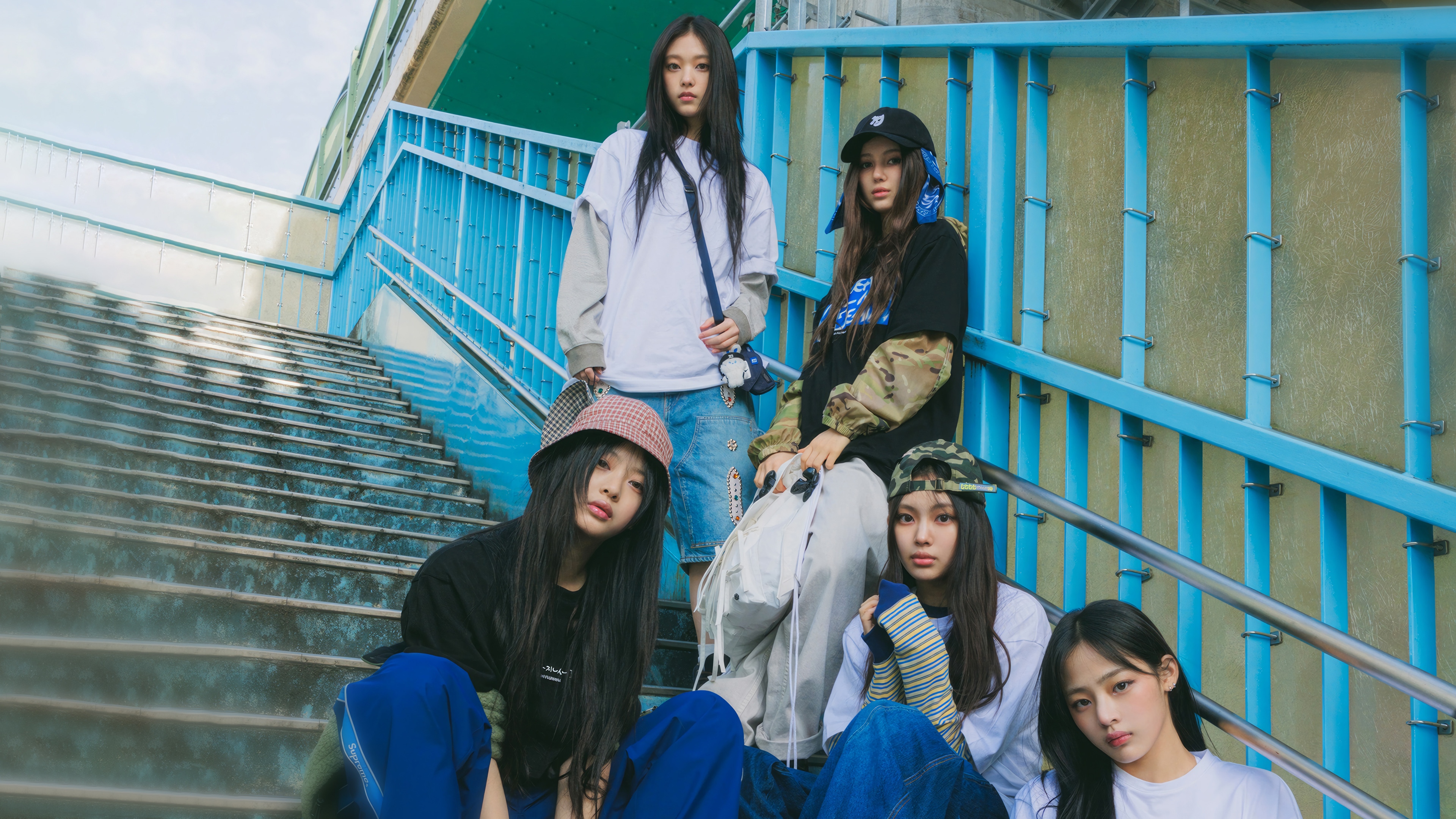 NewJeans girls posing on stairs HD Wallpaper