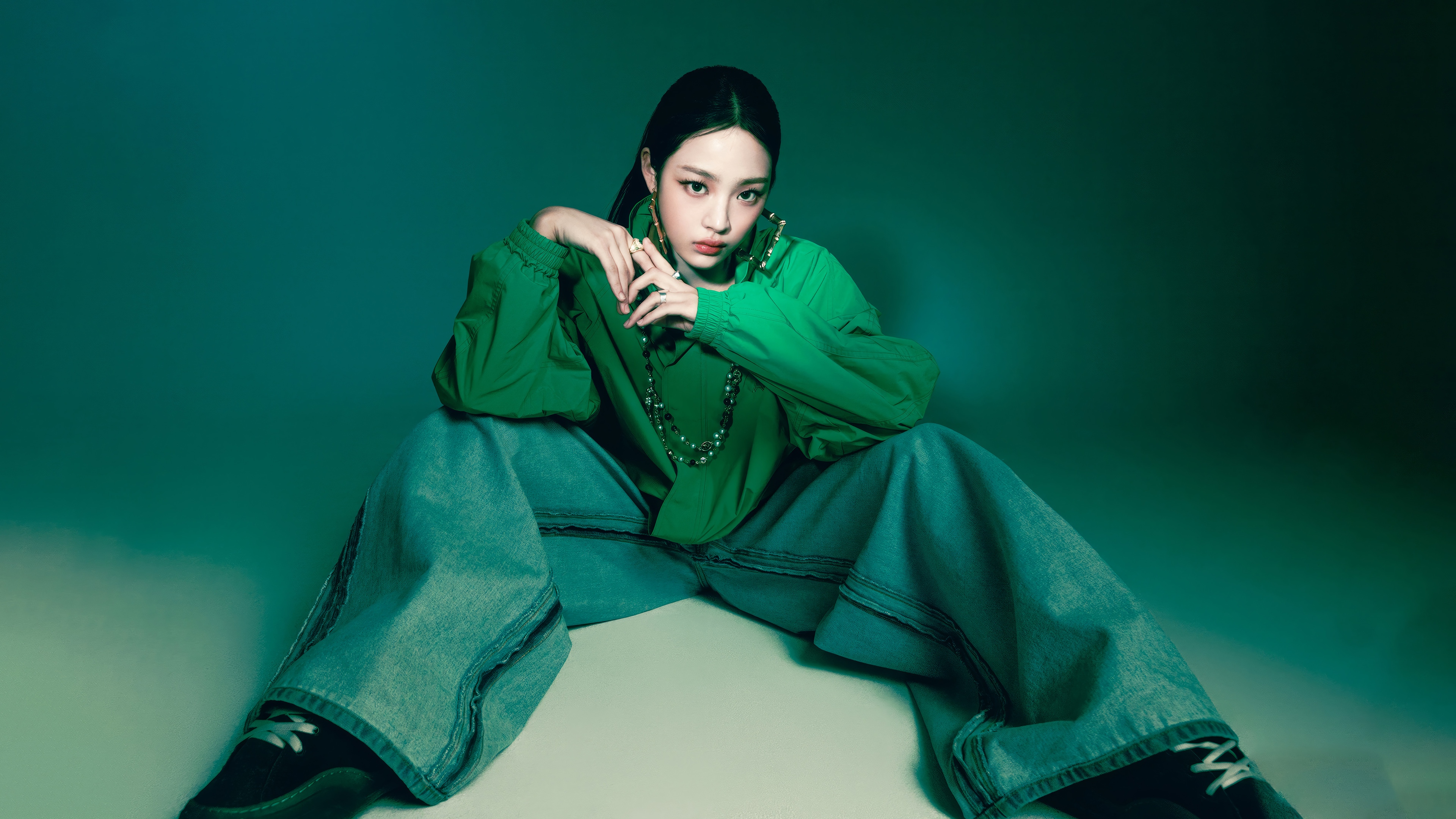 Minji from NewJeans in green shirt and jeans HD Wallpaper