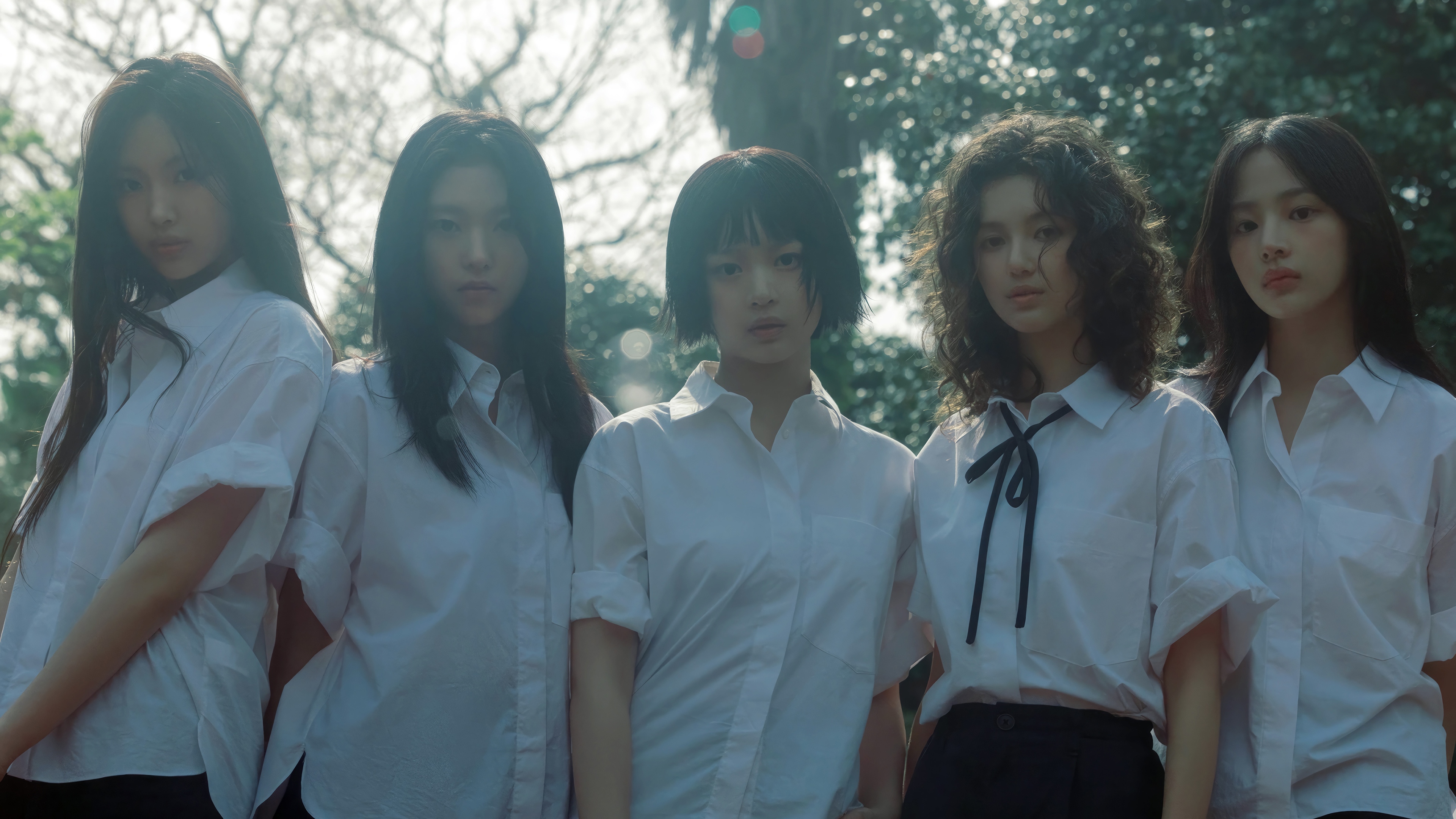 NewJeans members in white shirts outdoors HD Wallpaper