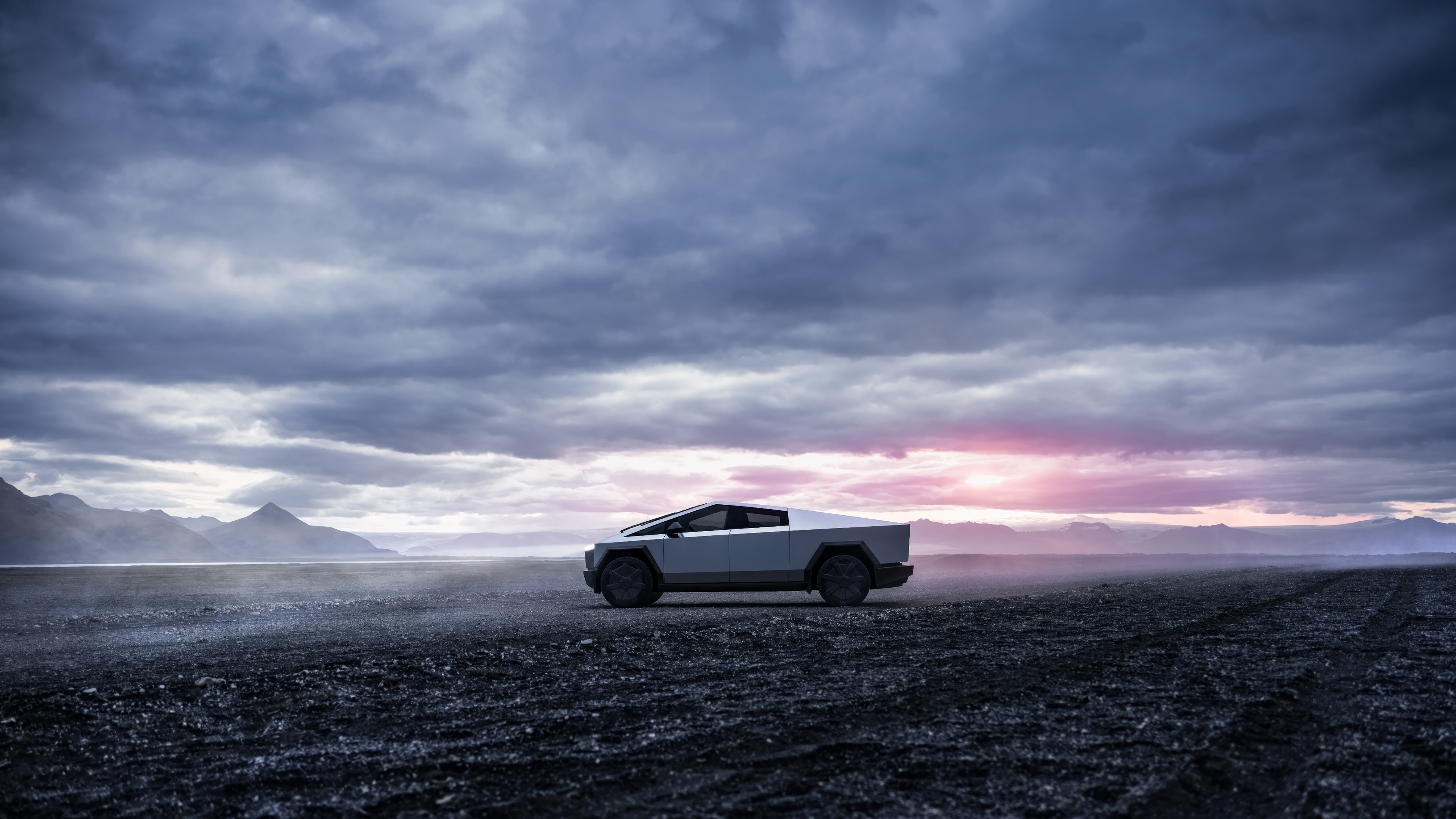 Tesla Cybertruck in a desolate landscape at sunrise HD Wallpaper