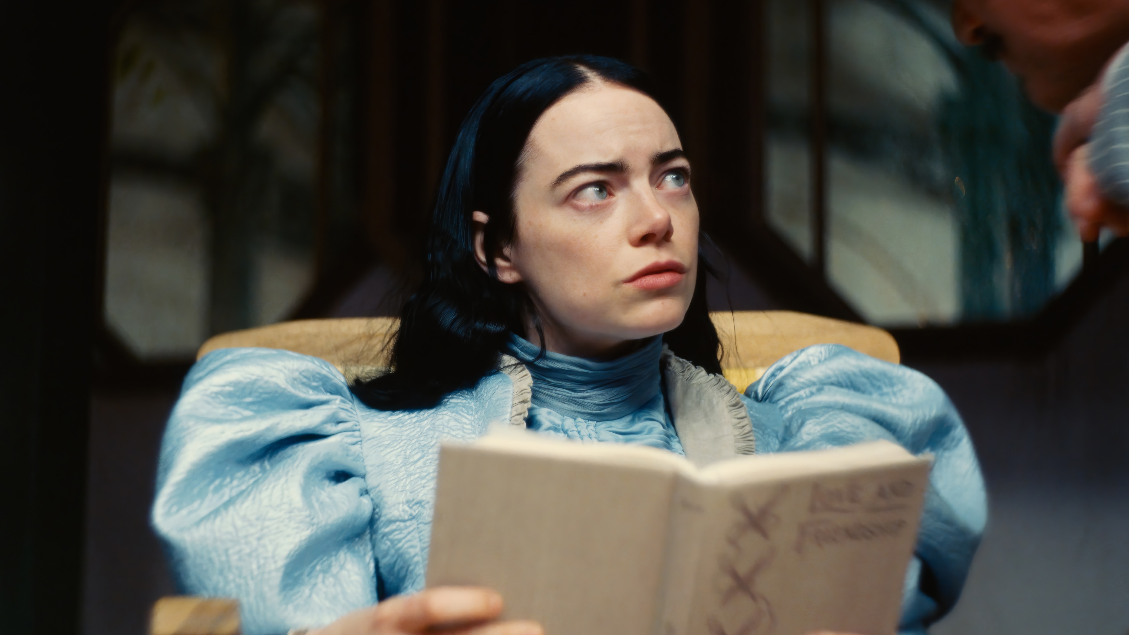 Poor Things 4K: Emma Stone Reads a Book HD Wallpaper