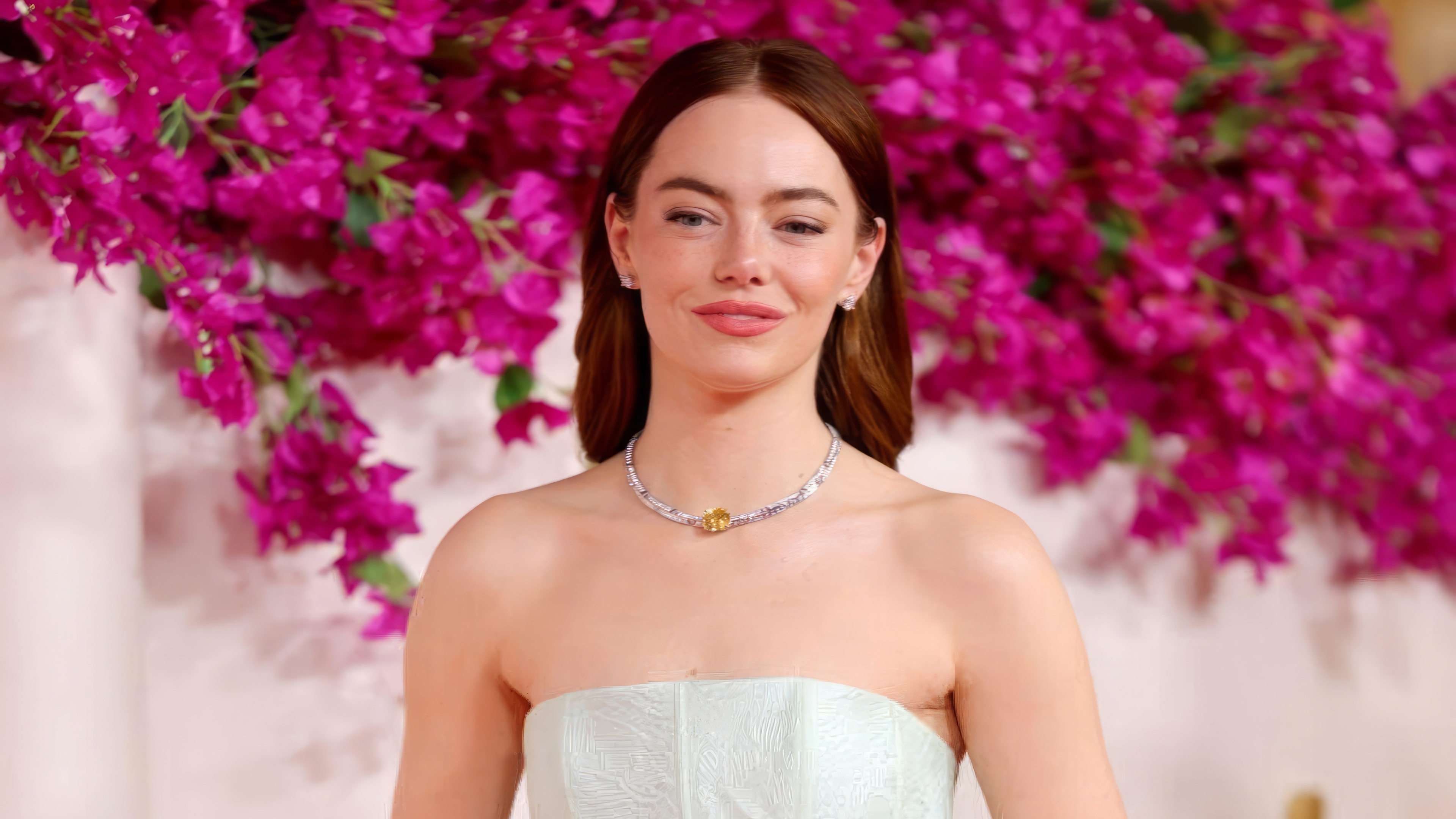 Emma Stone at an event with pink flowers HD Wallpaper