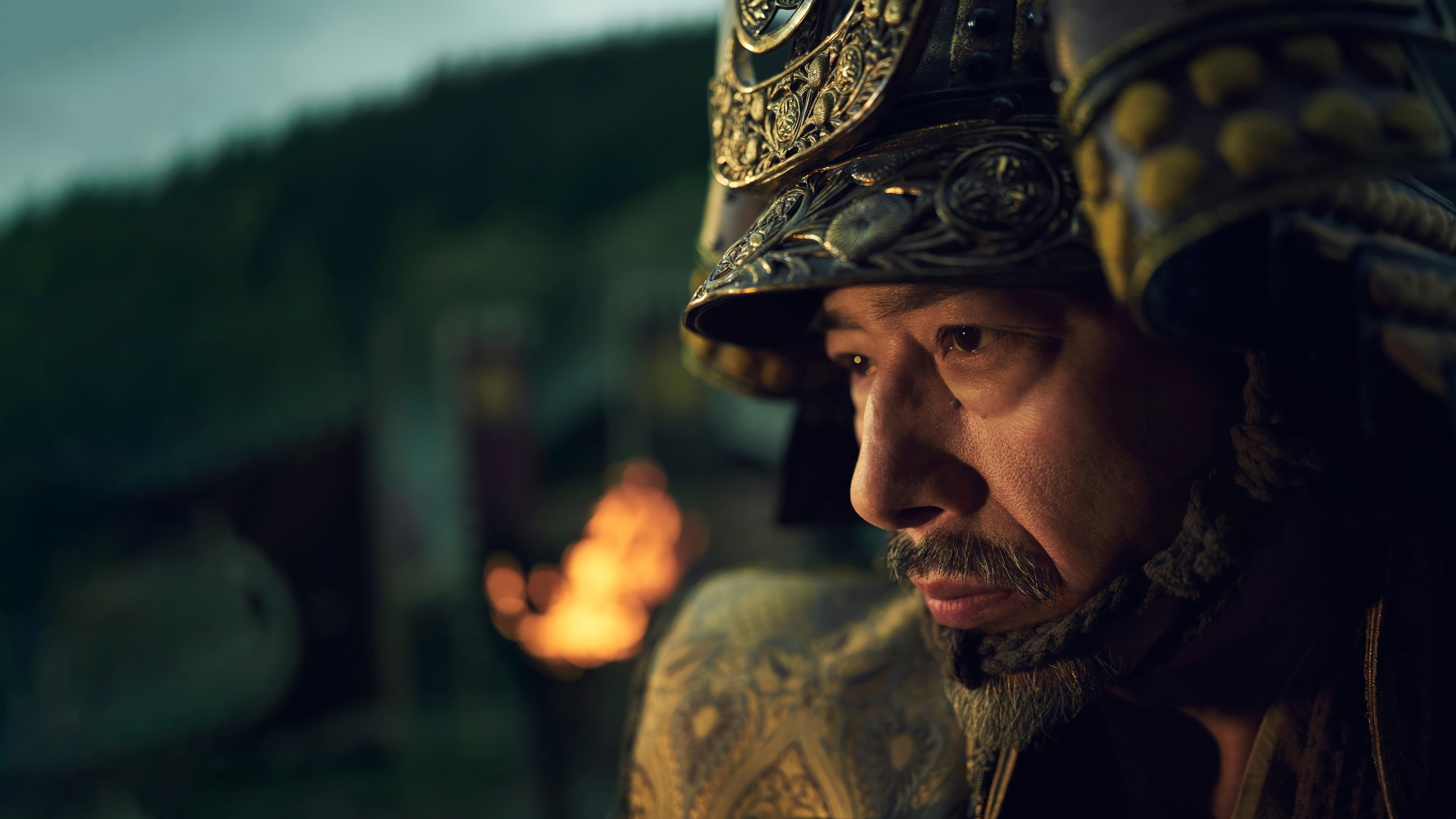 Samurai in ornate helmet with fire in background HD Wallpaper