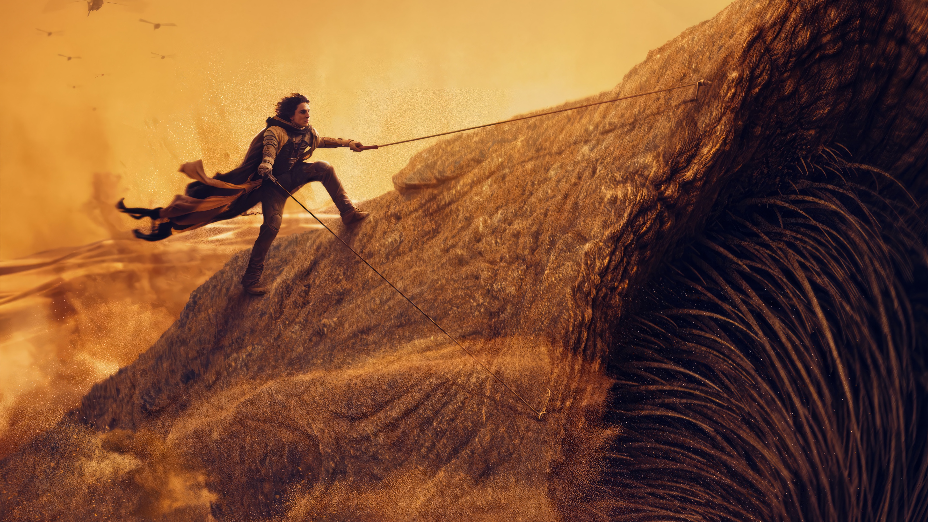Paul Atreides climbing a Sandworm in Dune: Part 2 4K HD Wallpaper