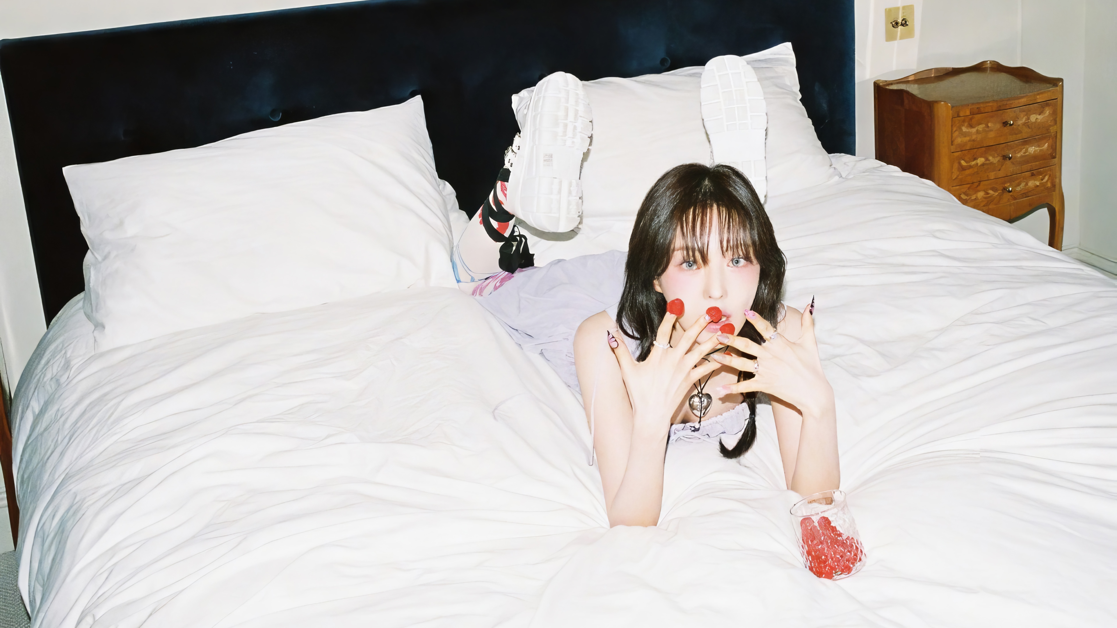 Wendy from Red Velvet lying on a bed HD Wallpaper
