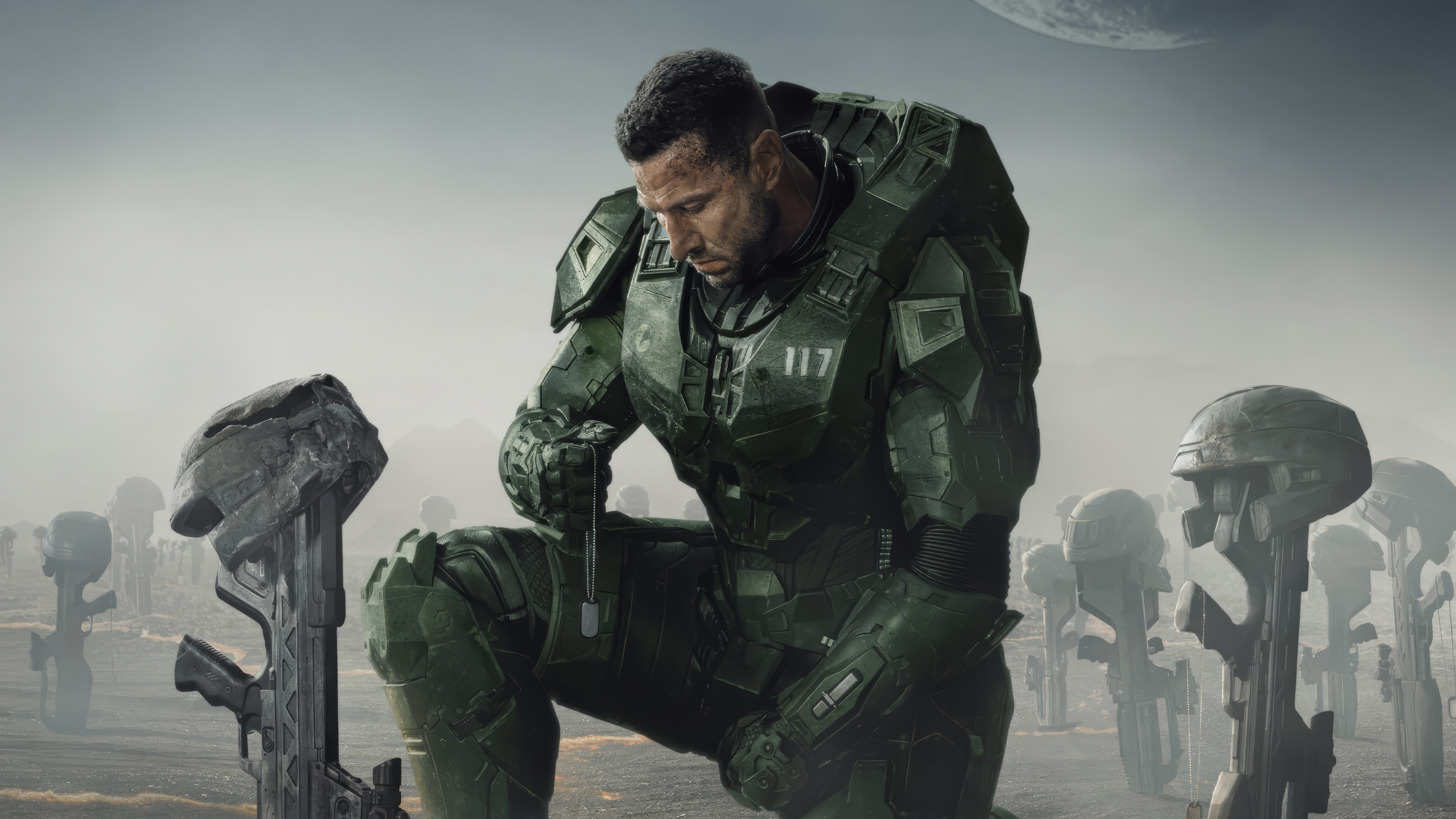 Master Chief kneeling in a field of fallen soldiers HD Wallpaper
