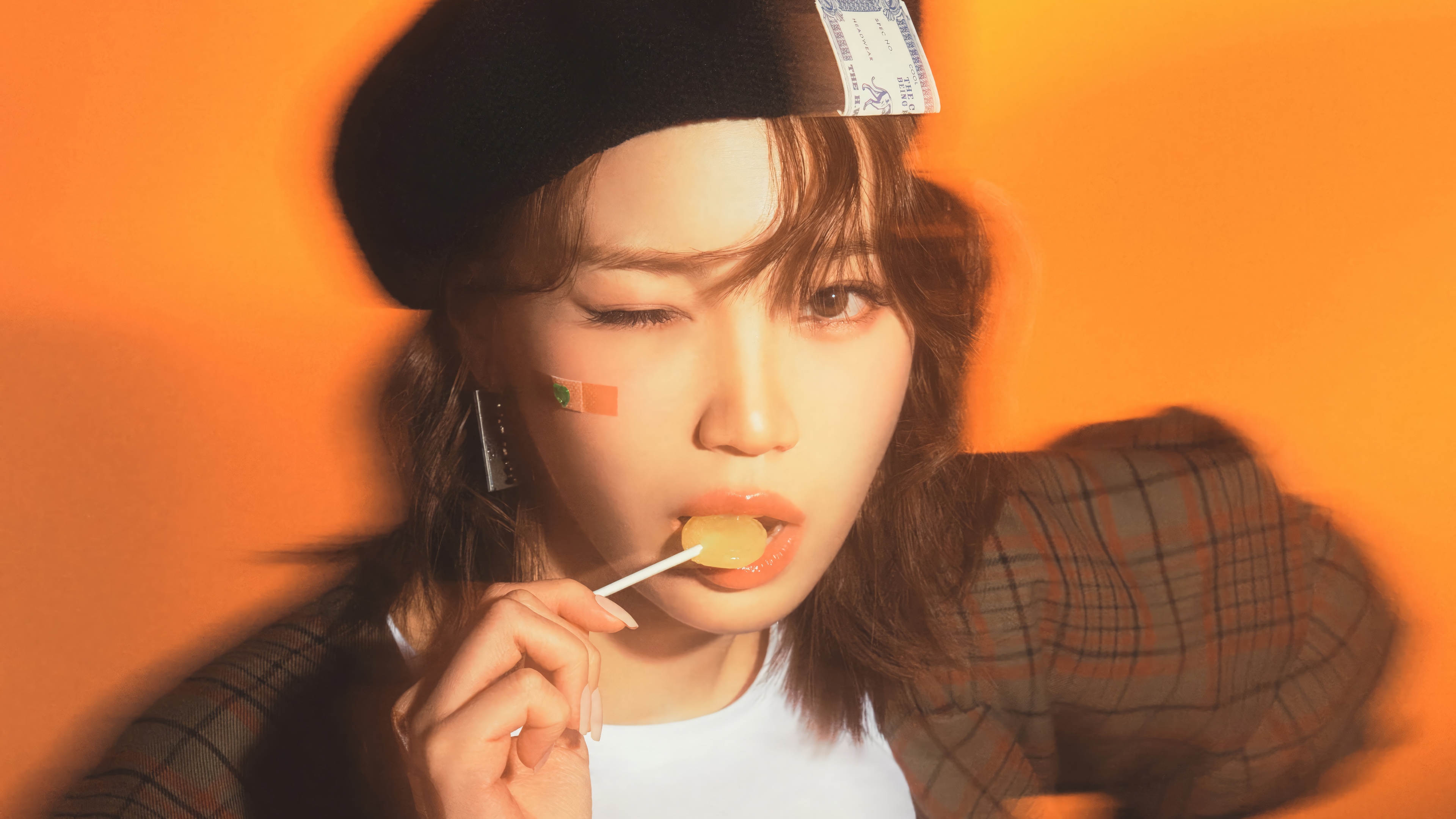 Chaewon of LE SSERAFIM with a lollipop HD Wallpaper