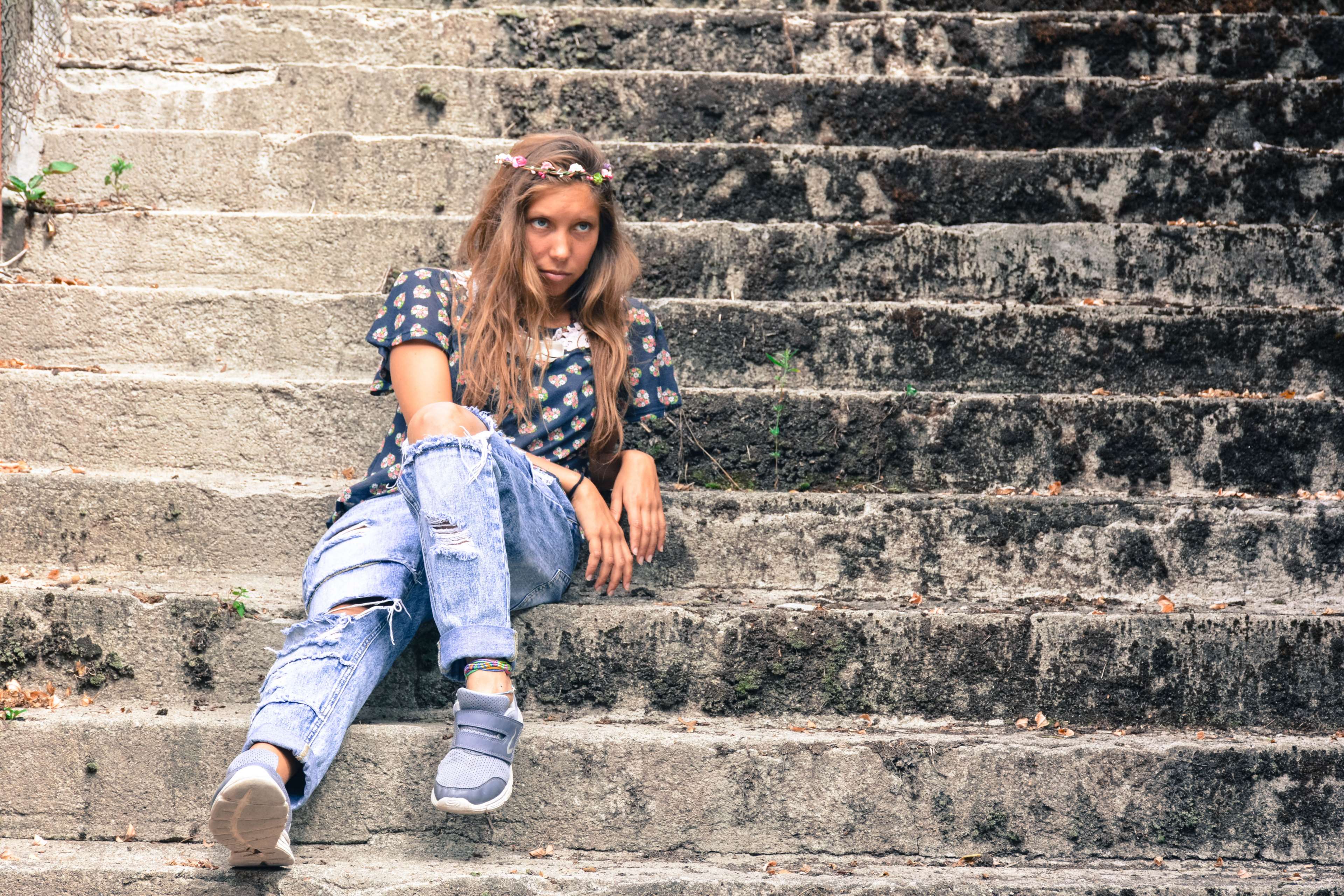 Woman with flower crown sitting on stairs HD Wallpaper
