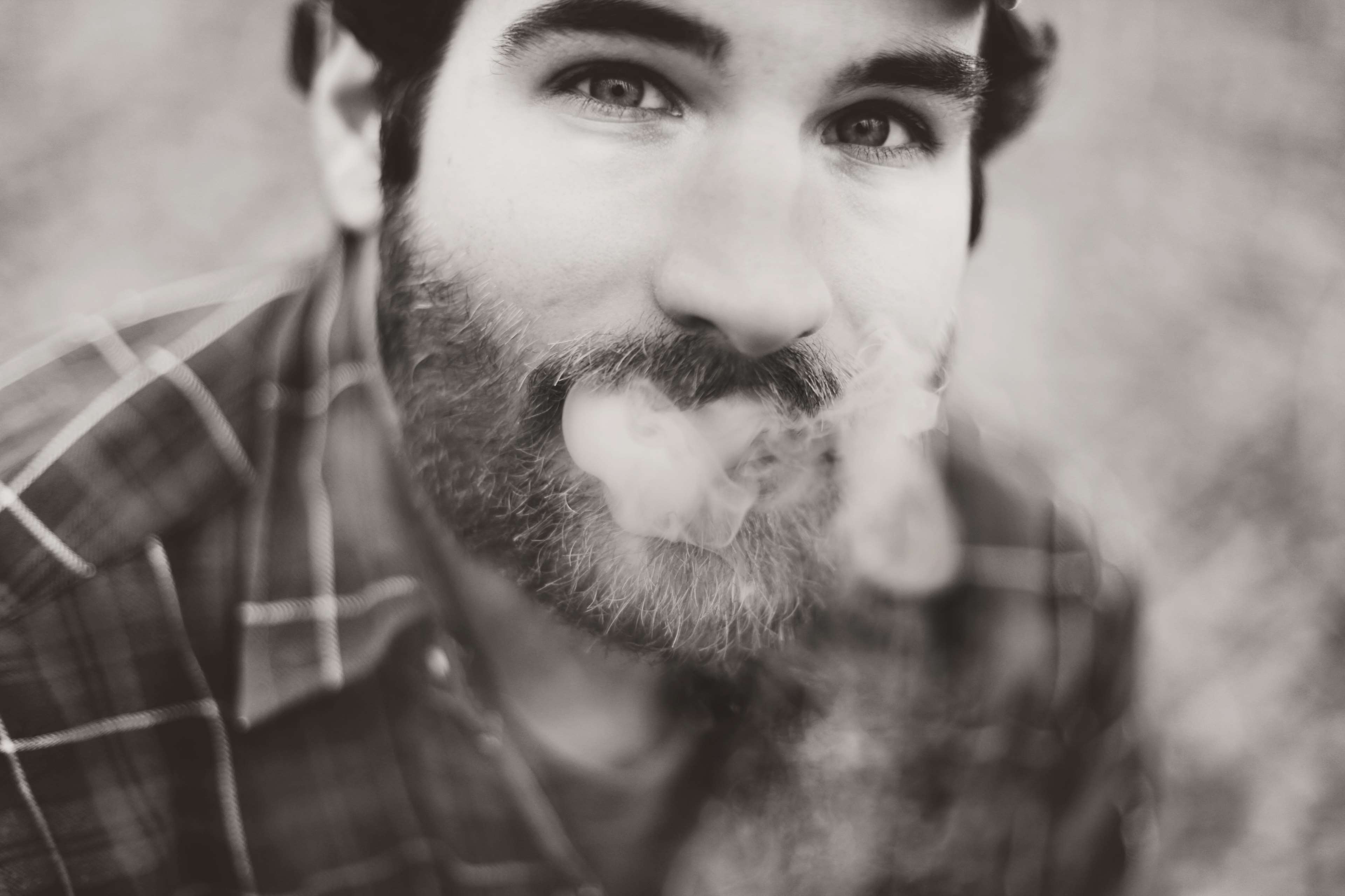 Man with beard smoking, close up portrait HD Wallpaper