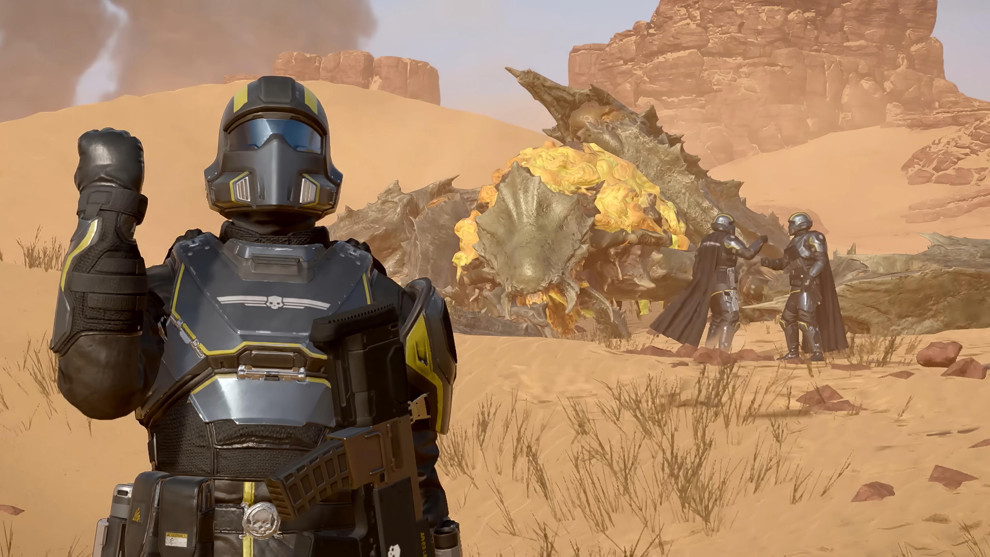 Helldivers 2 soldiers in a desert landscape HD Wallpaper