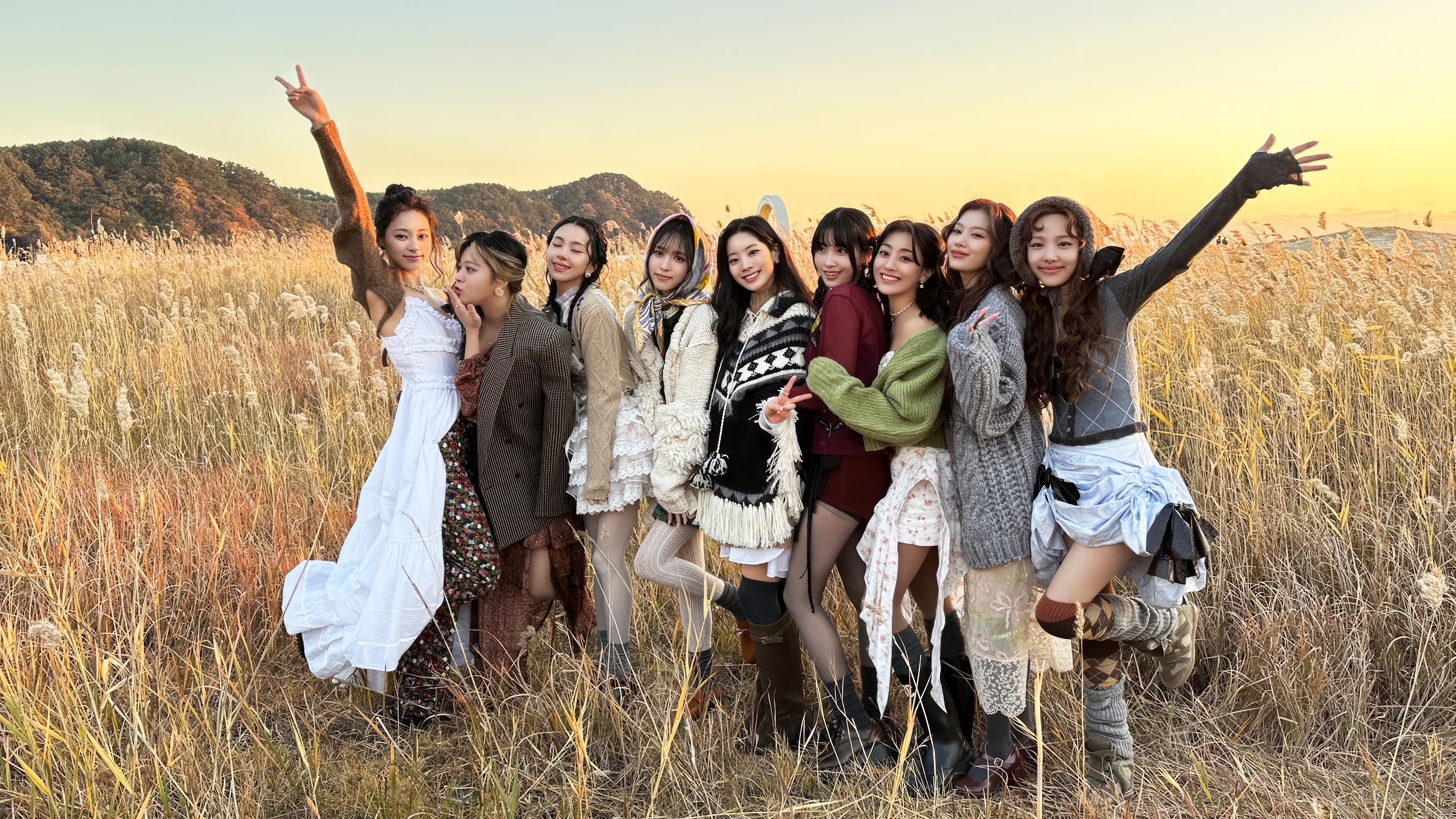 TWICE girls posing in a field at sunset 4K HD Wallpaper