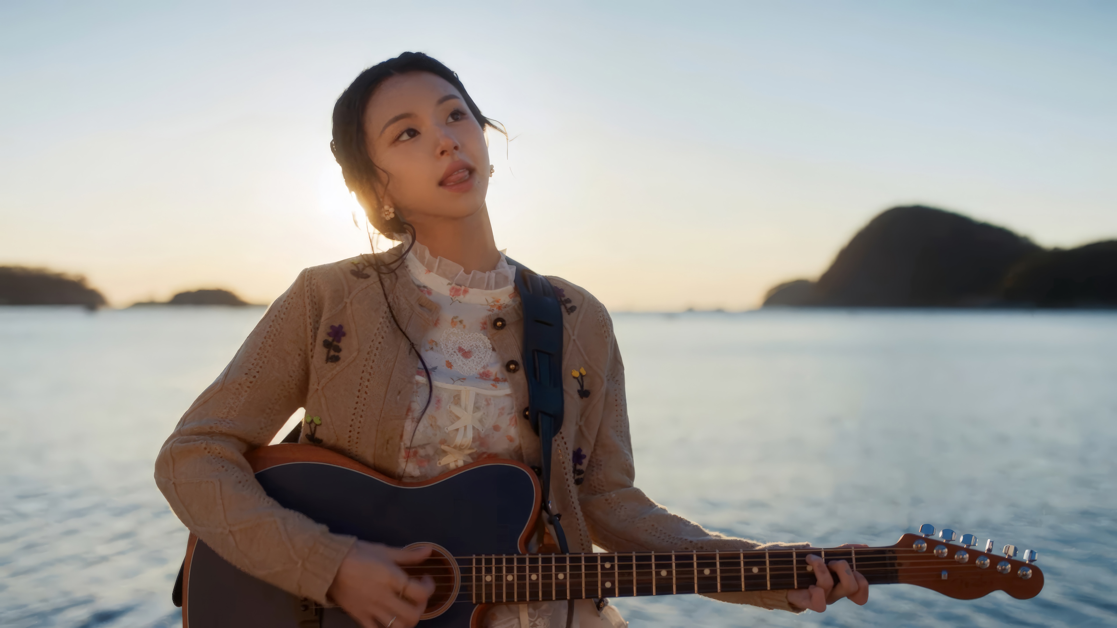 Chaeyoung of TWICE plays guitar by the sea at sunset HD Wallpaper