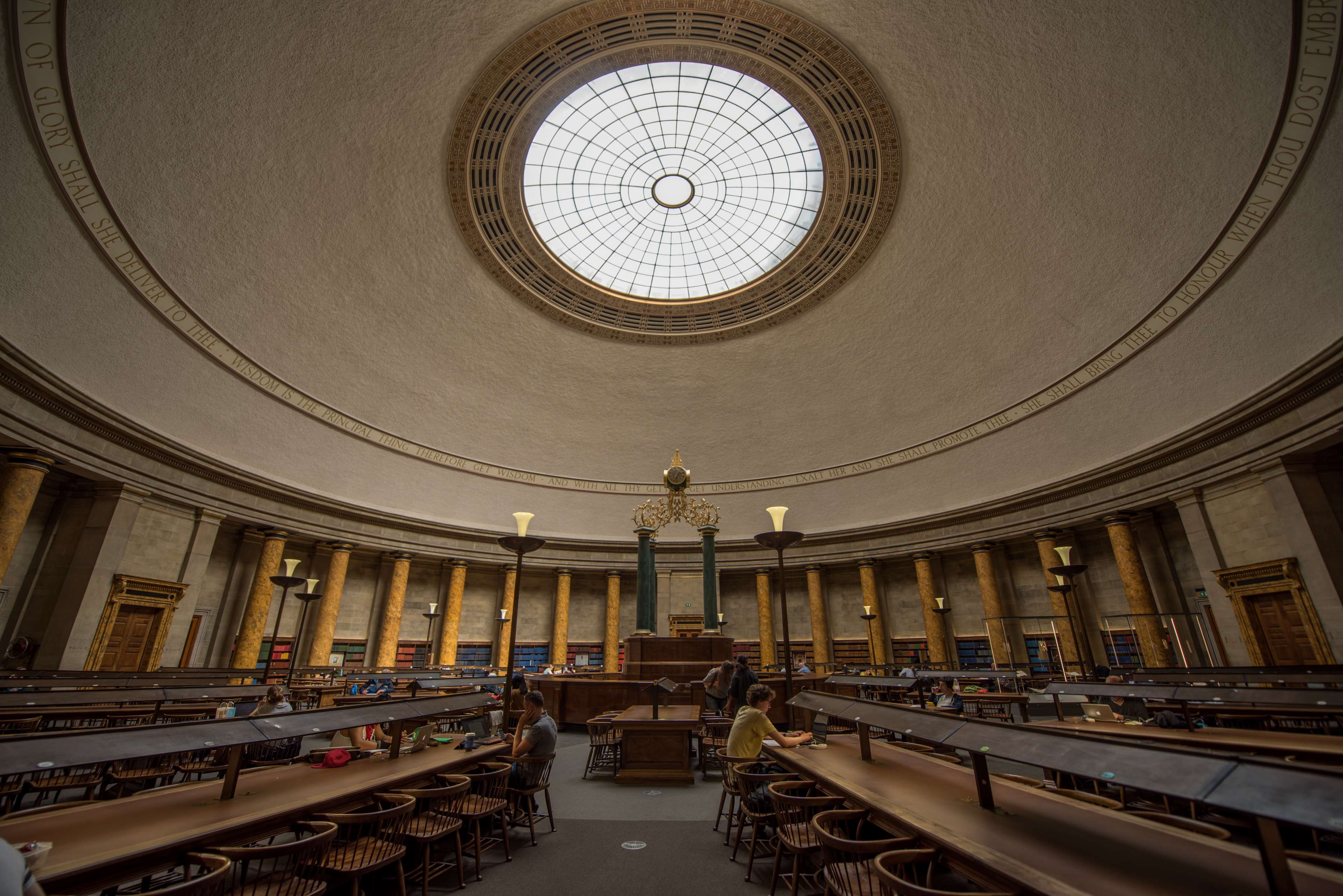 Interior of a grand library with a dome ceiling and pillars HD Wallpaper