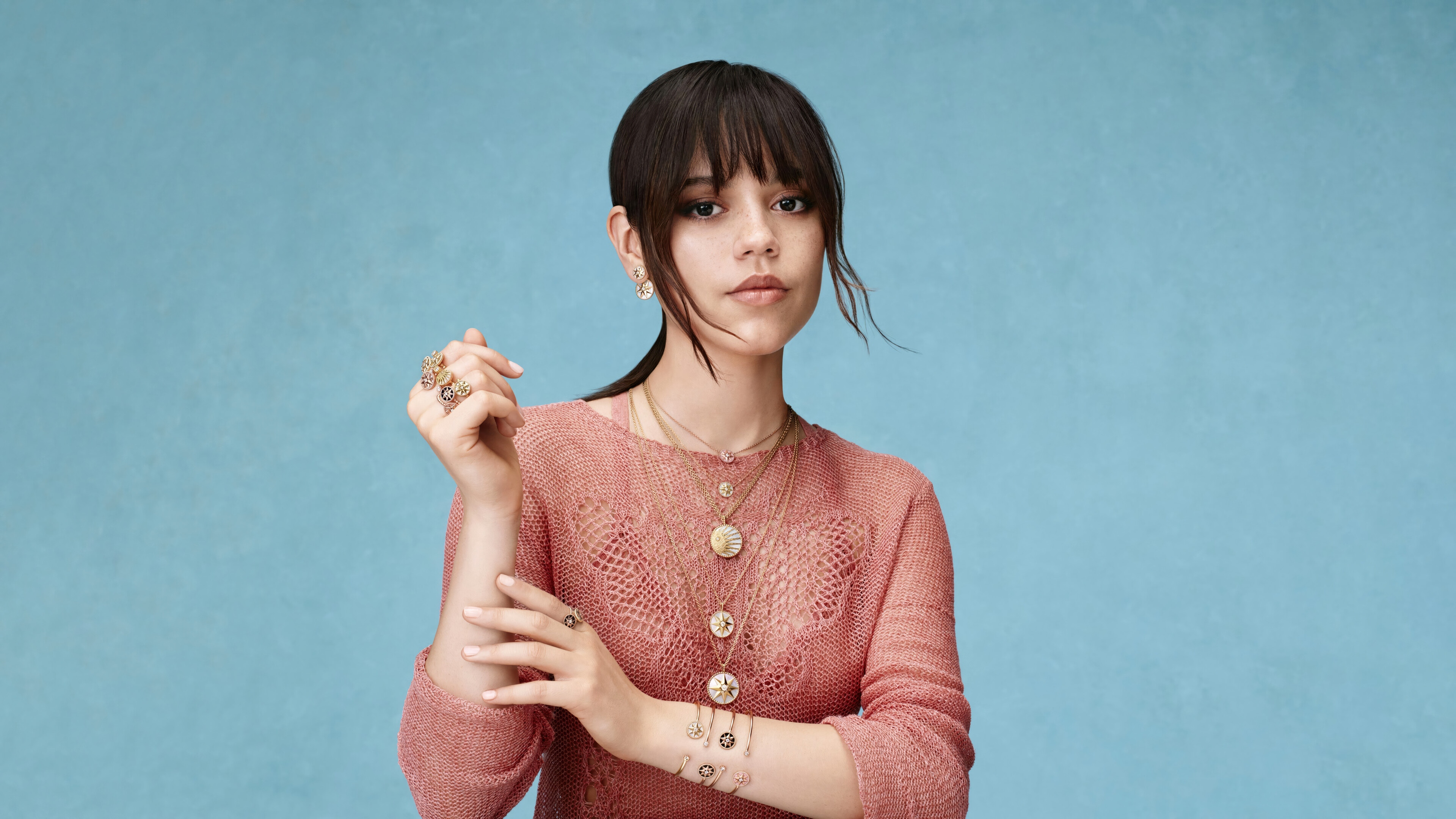 Jenna Ortega in a pink sweater with necklaces HD Wallpaper