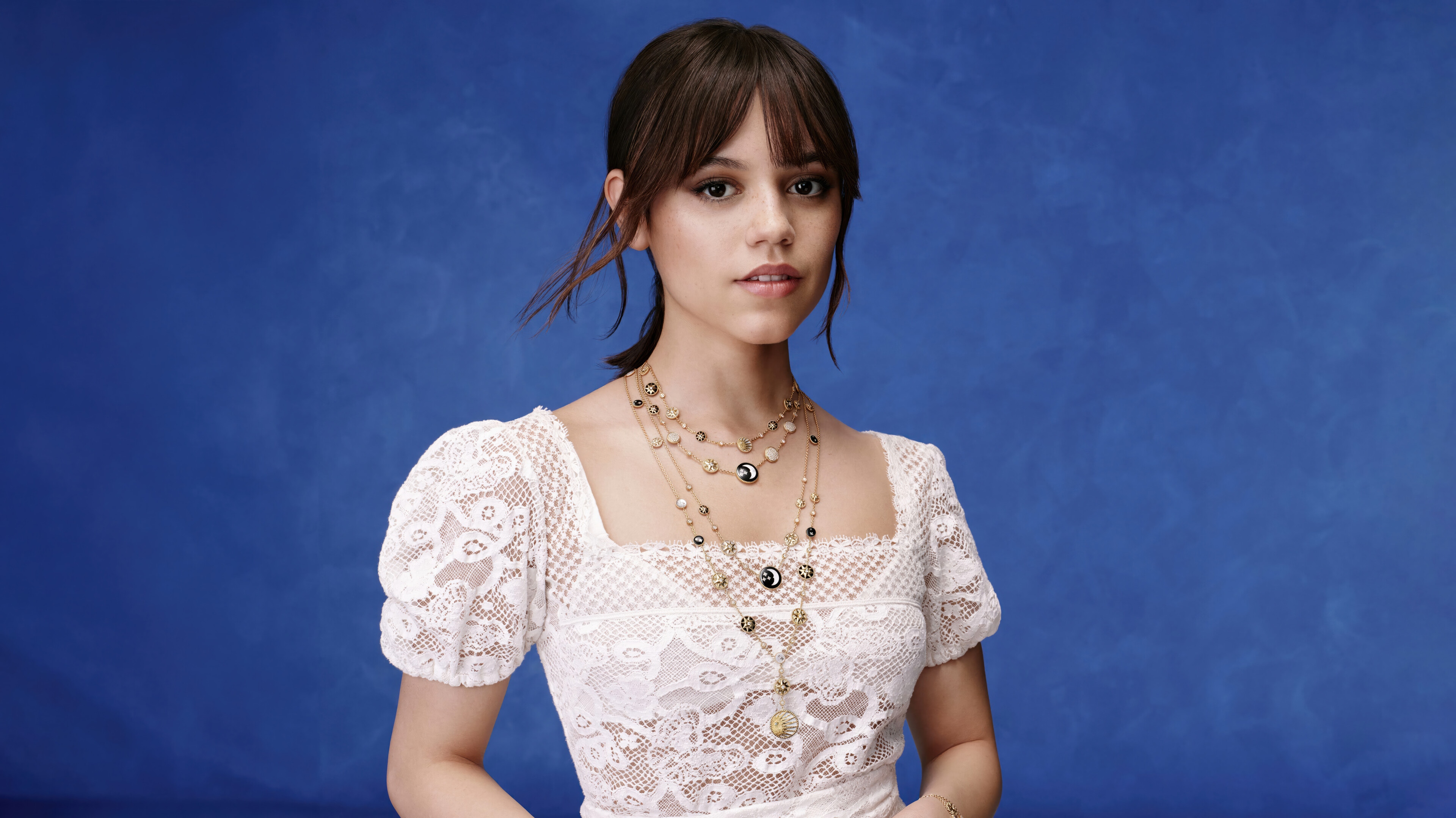 Jenna Ortega in white lace top with necklaces HD Wallpaper
