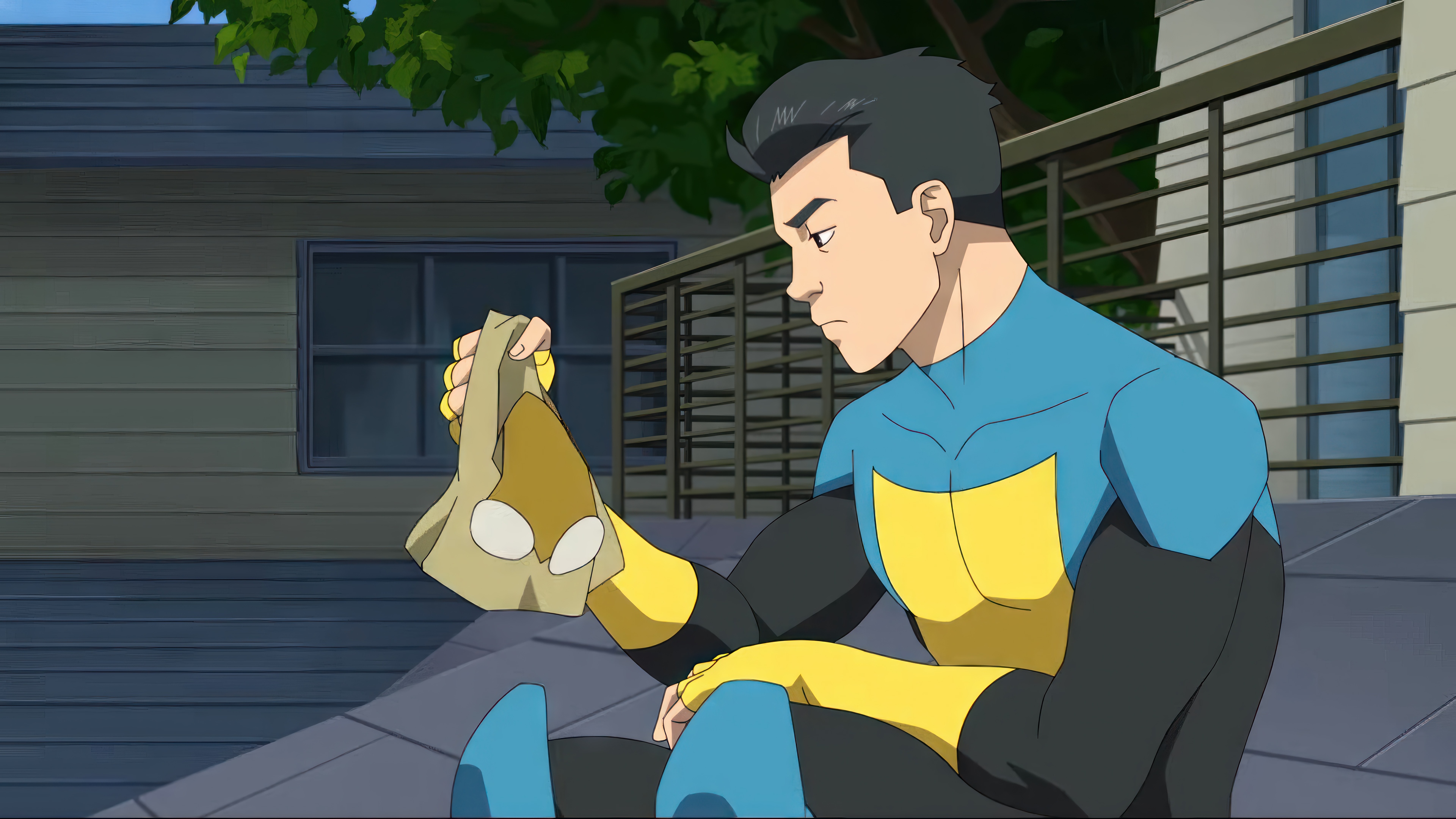 Invincible holding a mask HD Wallpaper