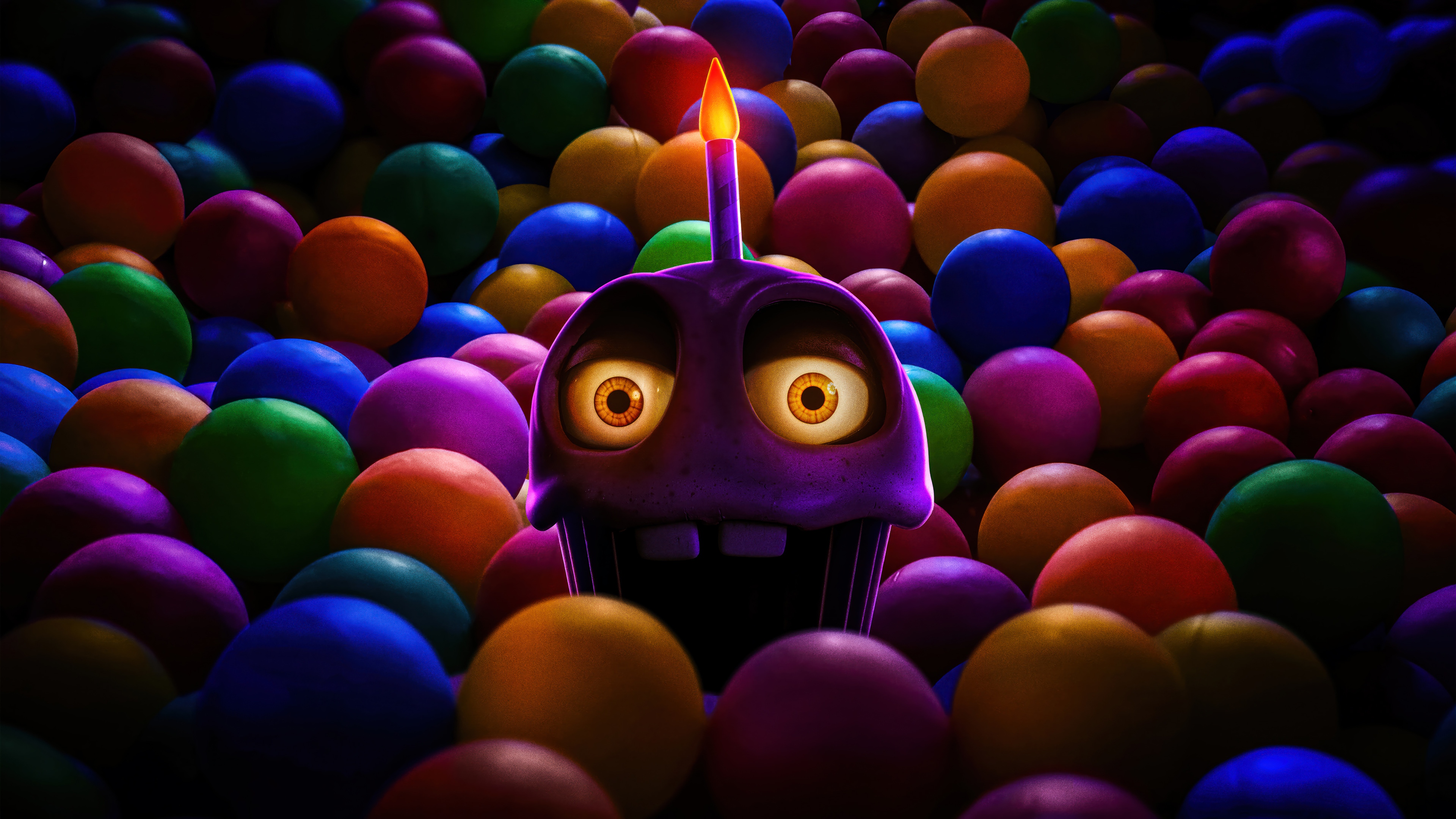 Horror cupcake with candle in ball pit 4K HD Wallpaper