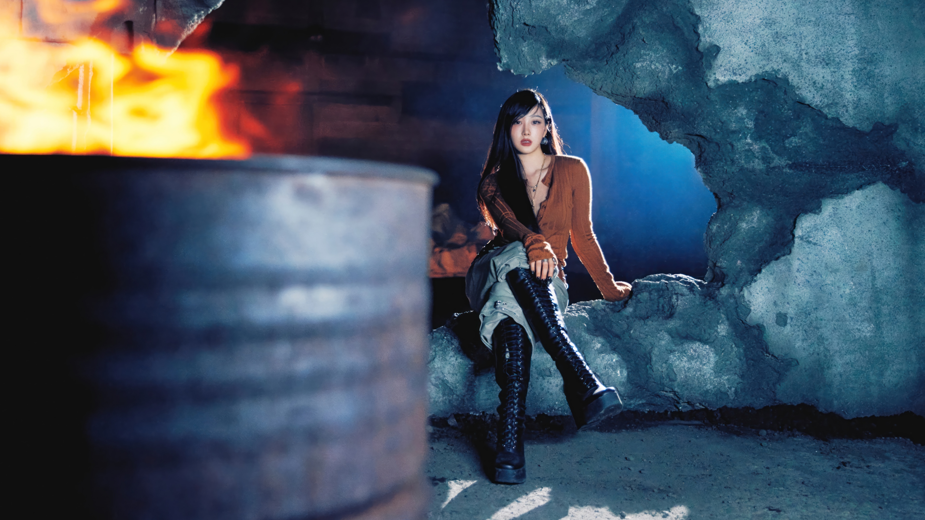 Giselle from Aespa in a dark, industrial setting with fire HD Wallpaper