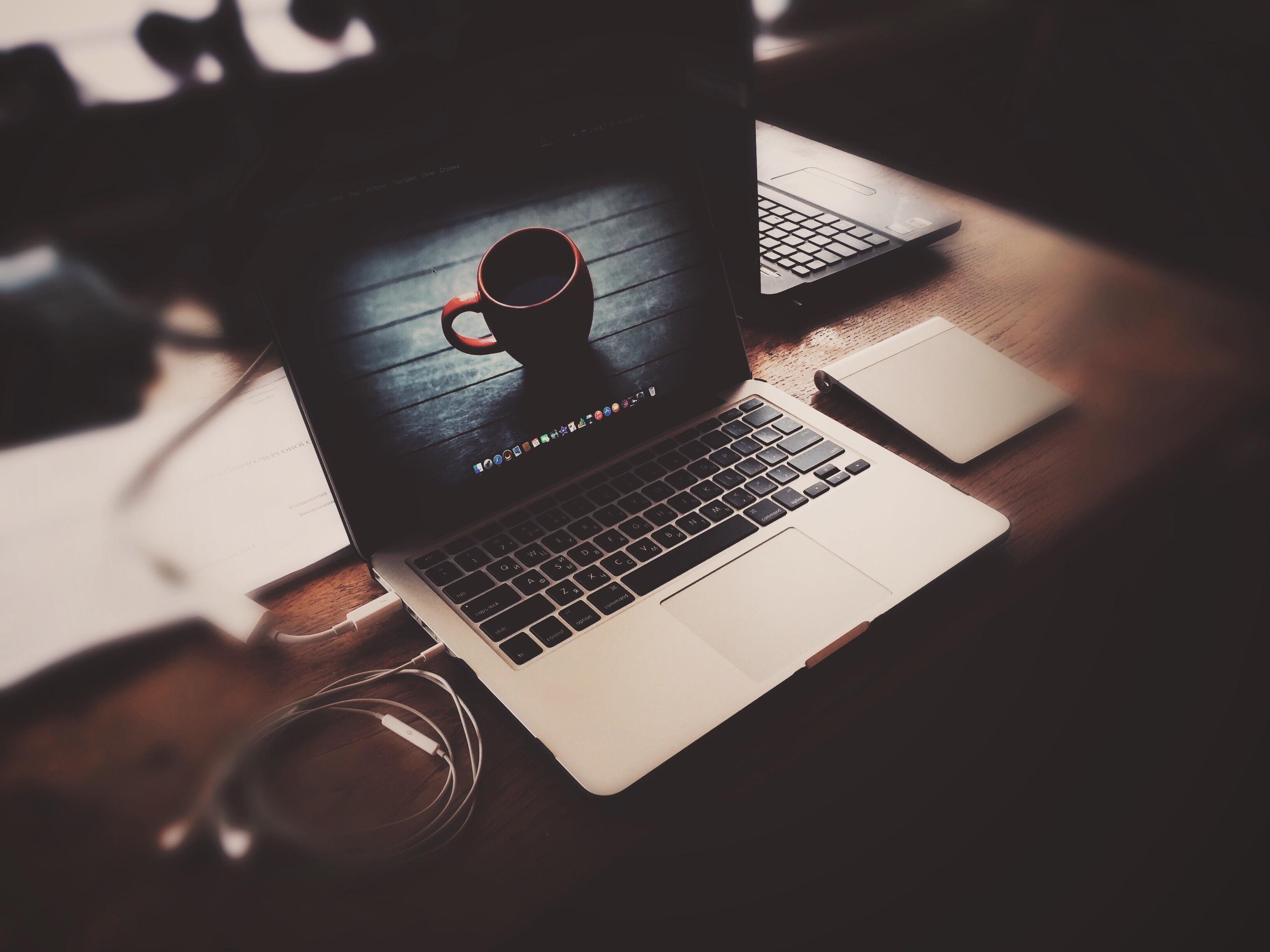 MacBook Pro with coffee and headphones on a table HD Wallpaper