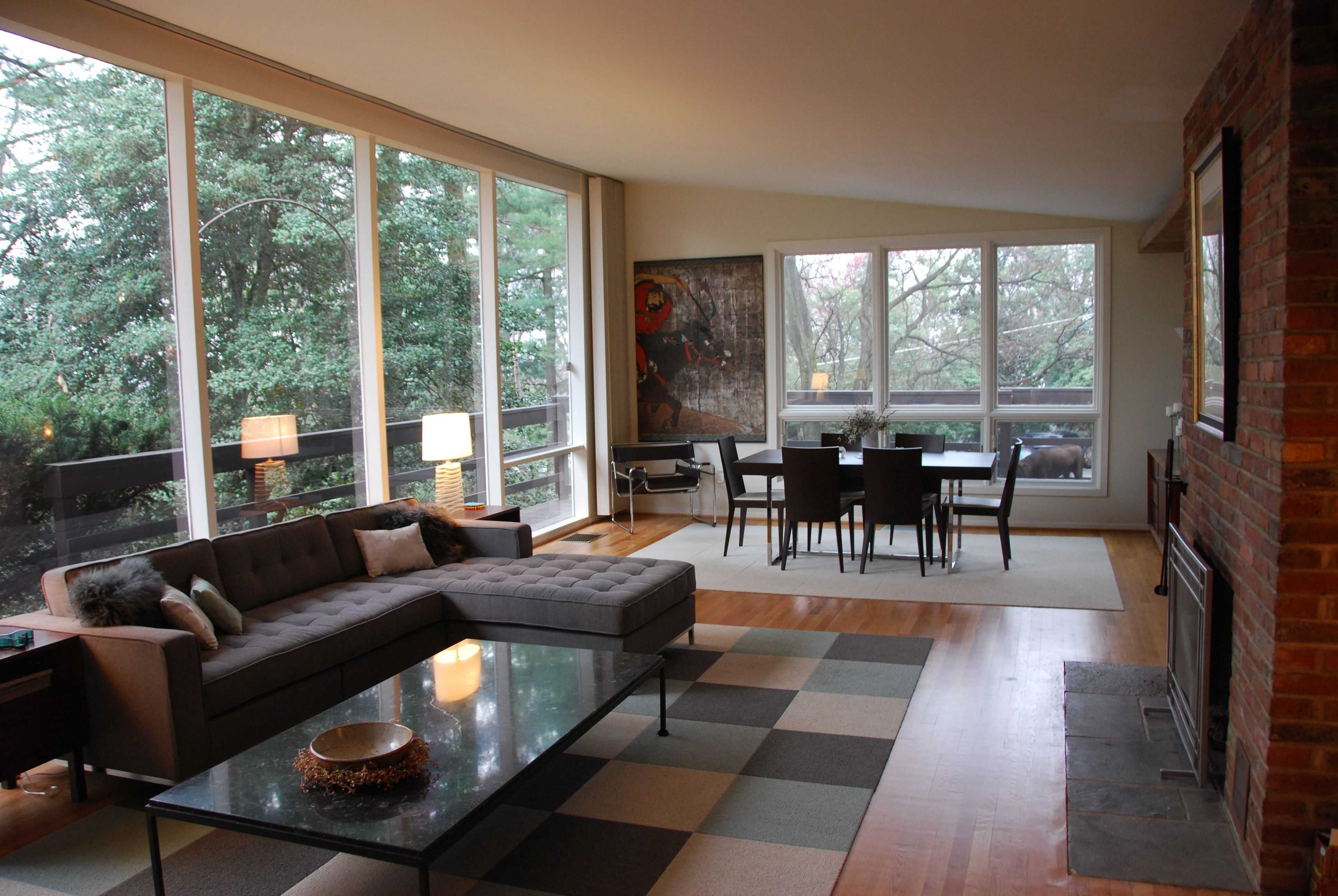 Modern living room with large windows and fireplace HD Wallpaper