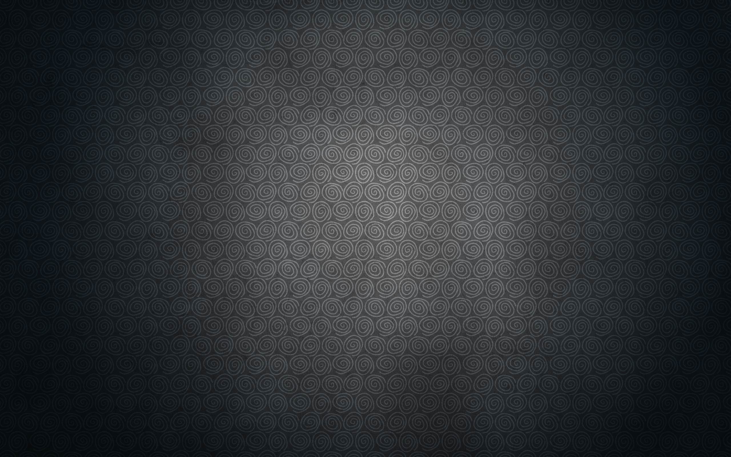 Dark textured background with a subtle spiral pattern HD Wallpaper