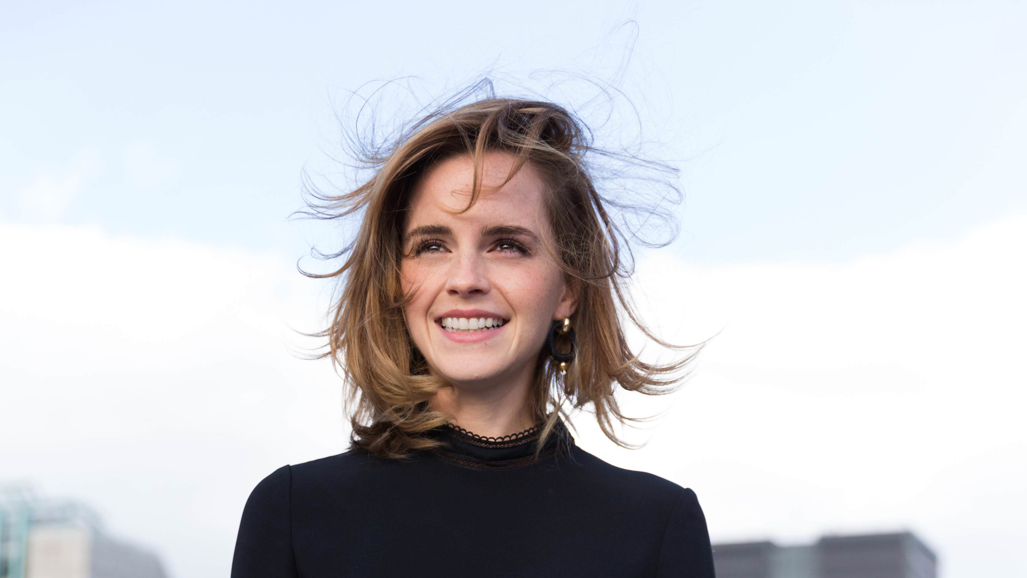 Emma Watson smiling outdoors HD Wallpaper