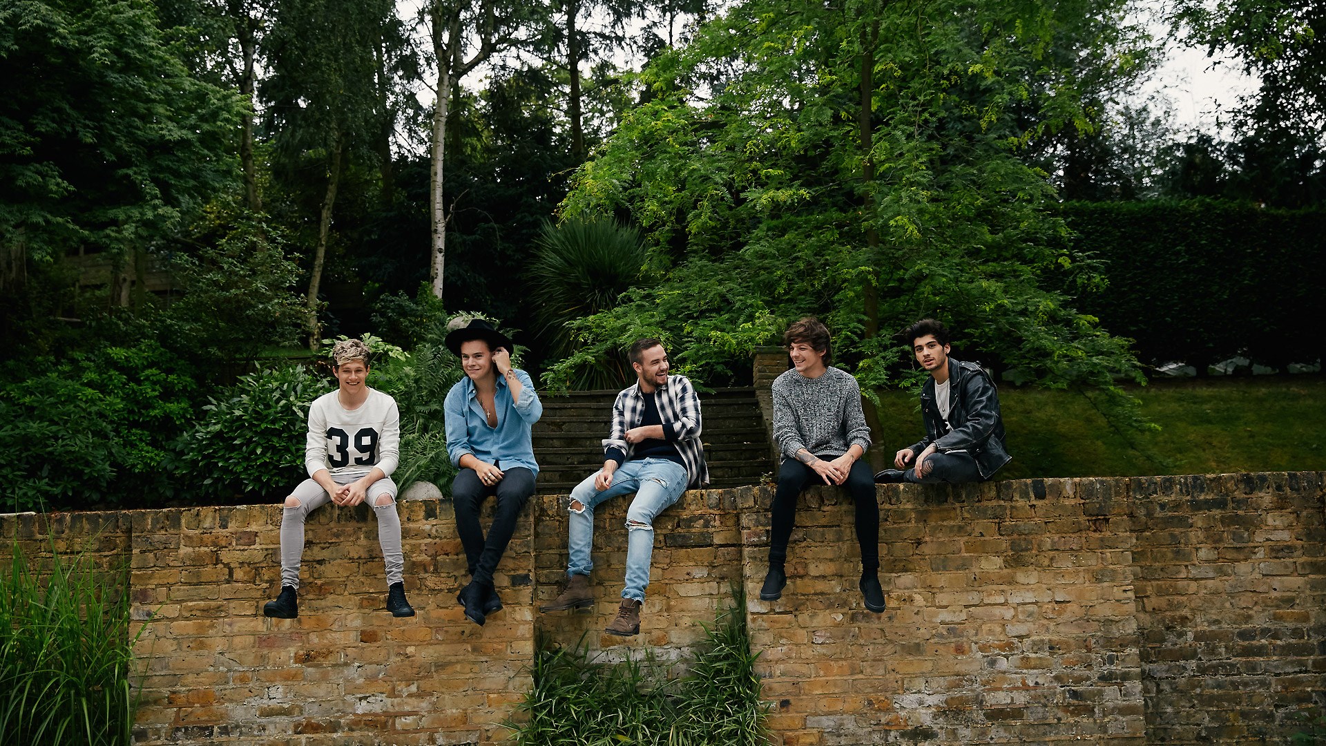 One Direction sitting on a brick wall HD Wallpaper