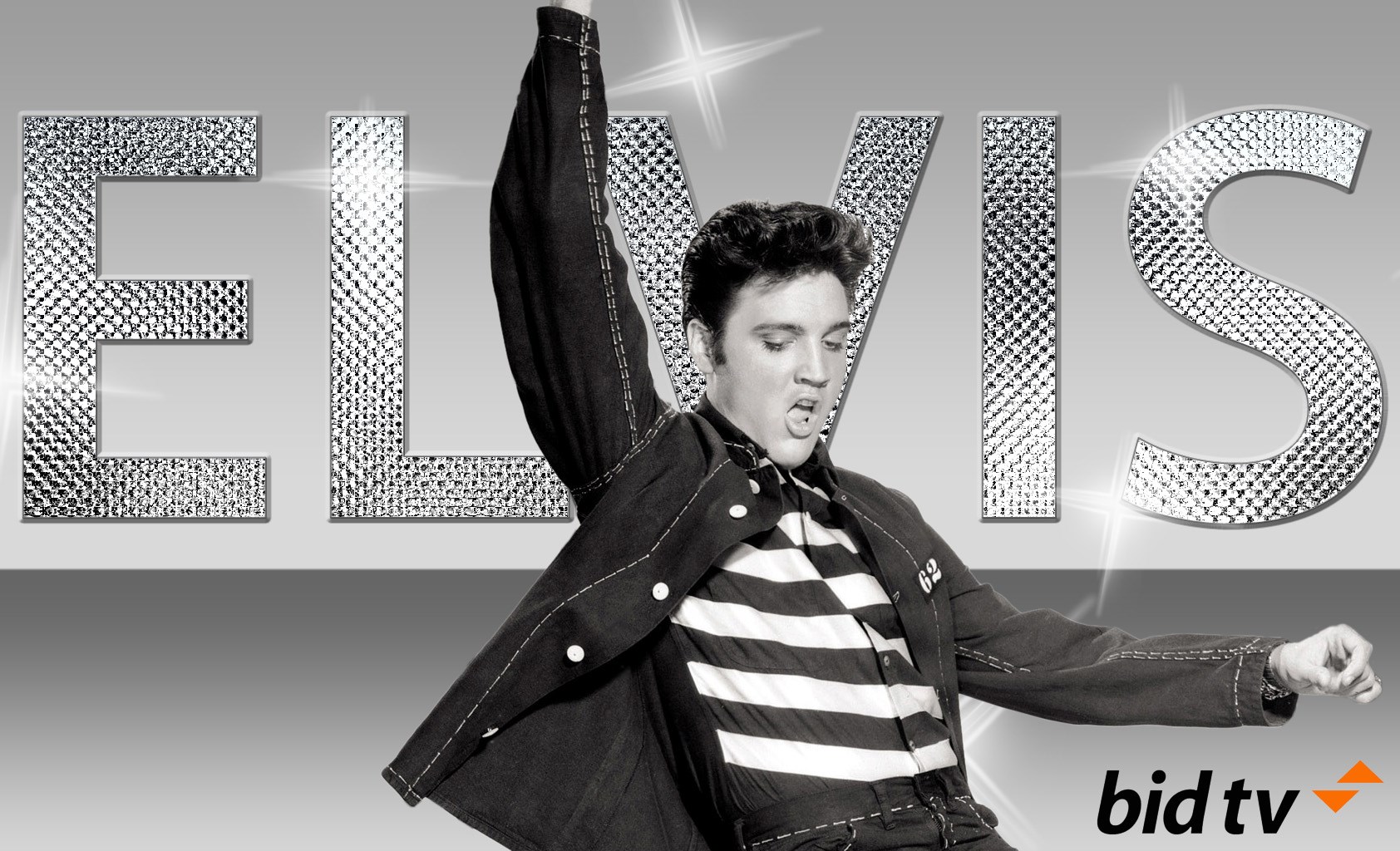 Elvis Presley performing on stage with ELVIS text HD Wallpaper