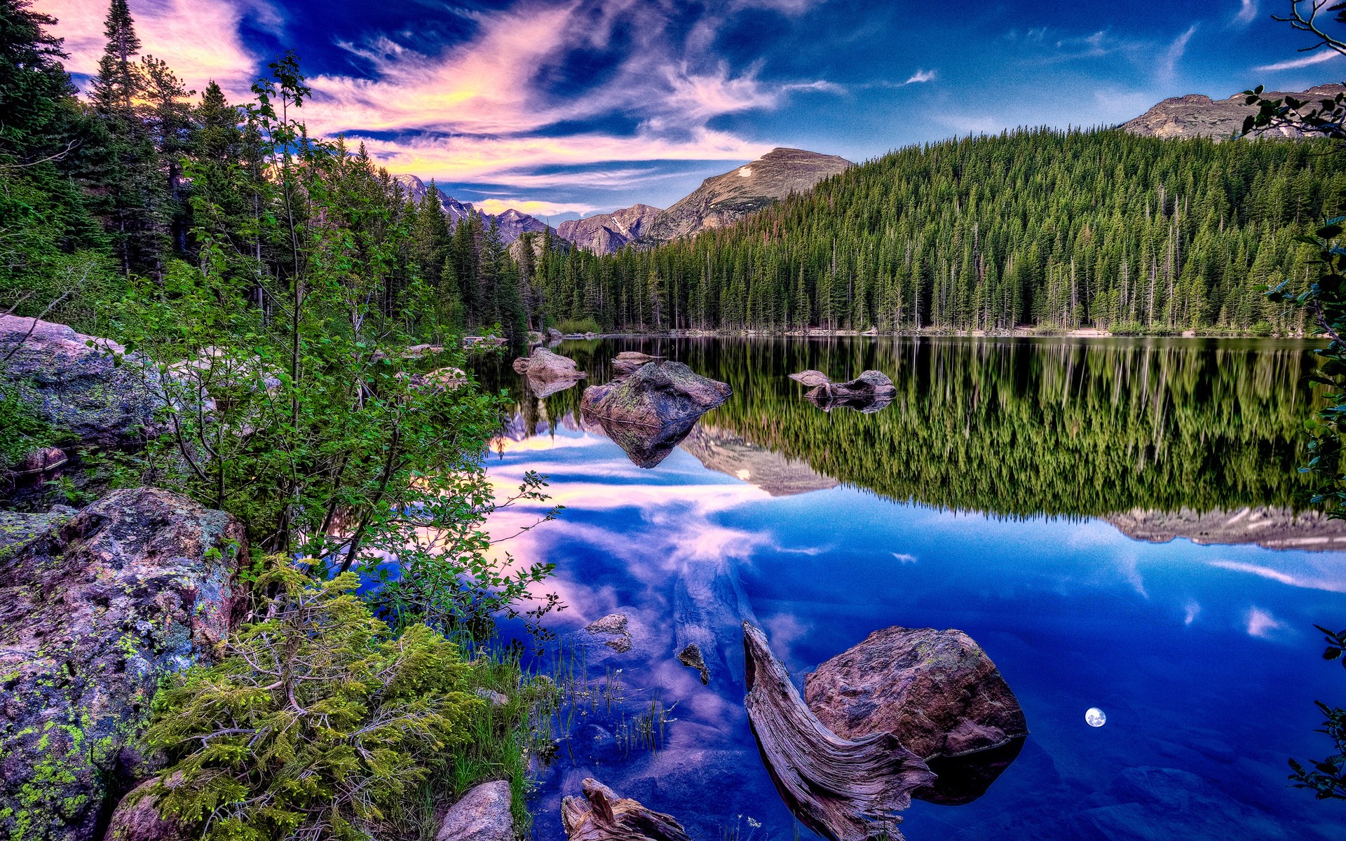 Lake reflection of pine forest and mountains at sunset HD Wallpaper