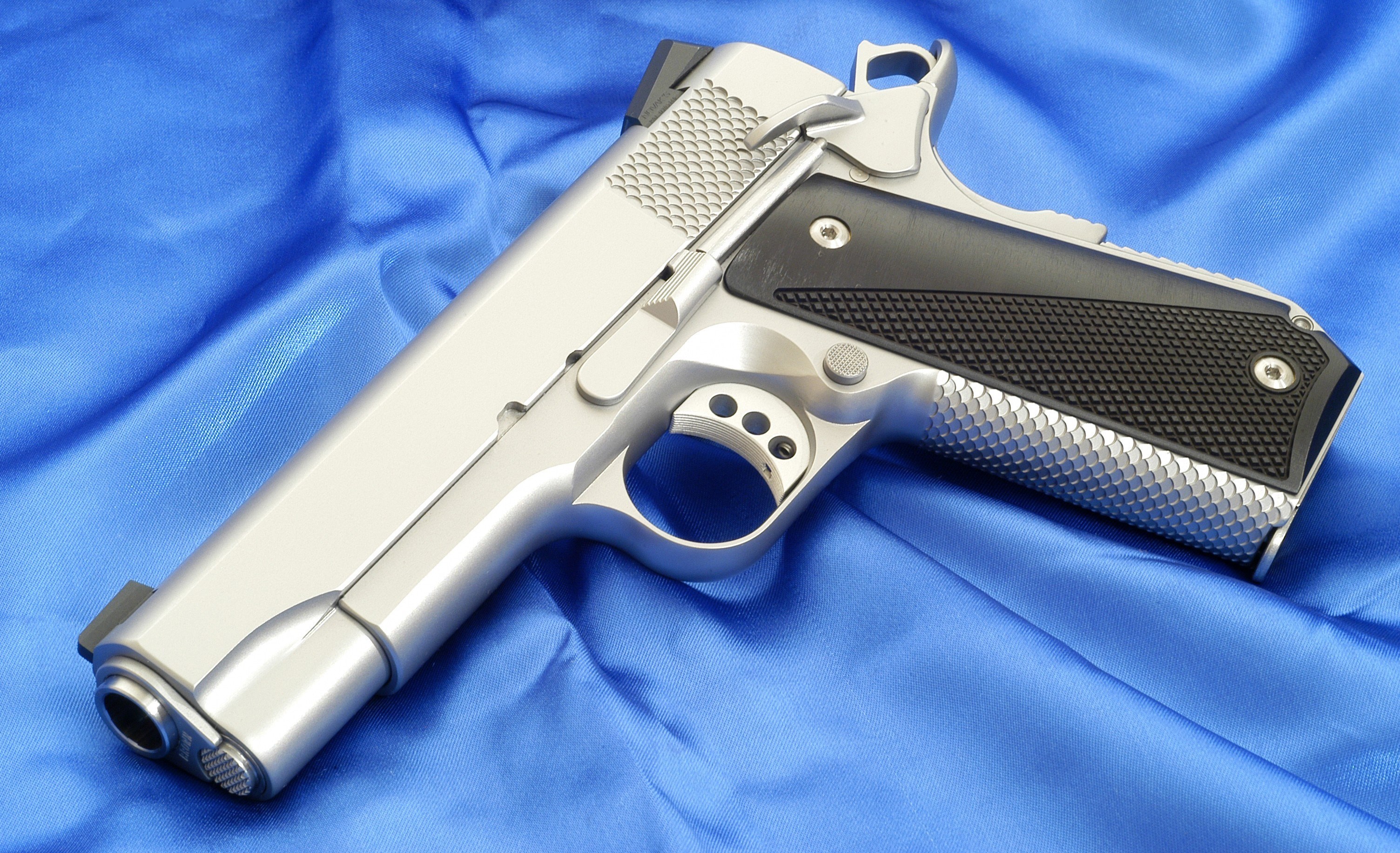 Ed Brown Kobra Carry pistol on blue fabric HD Wallpaper