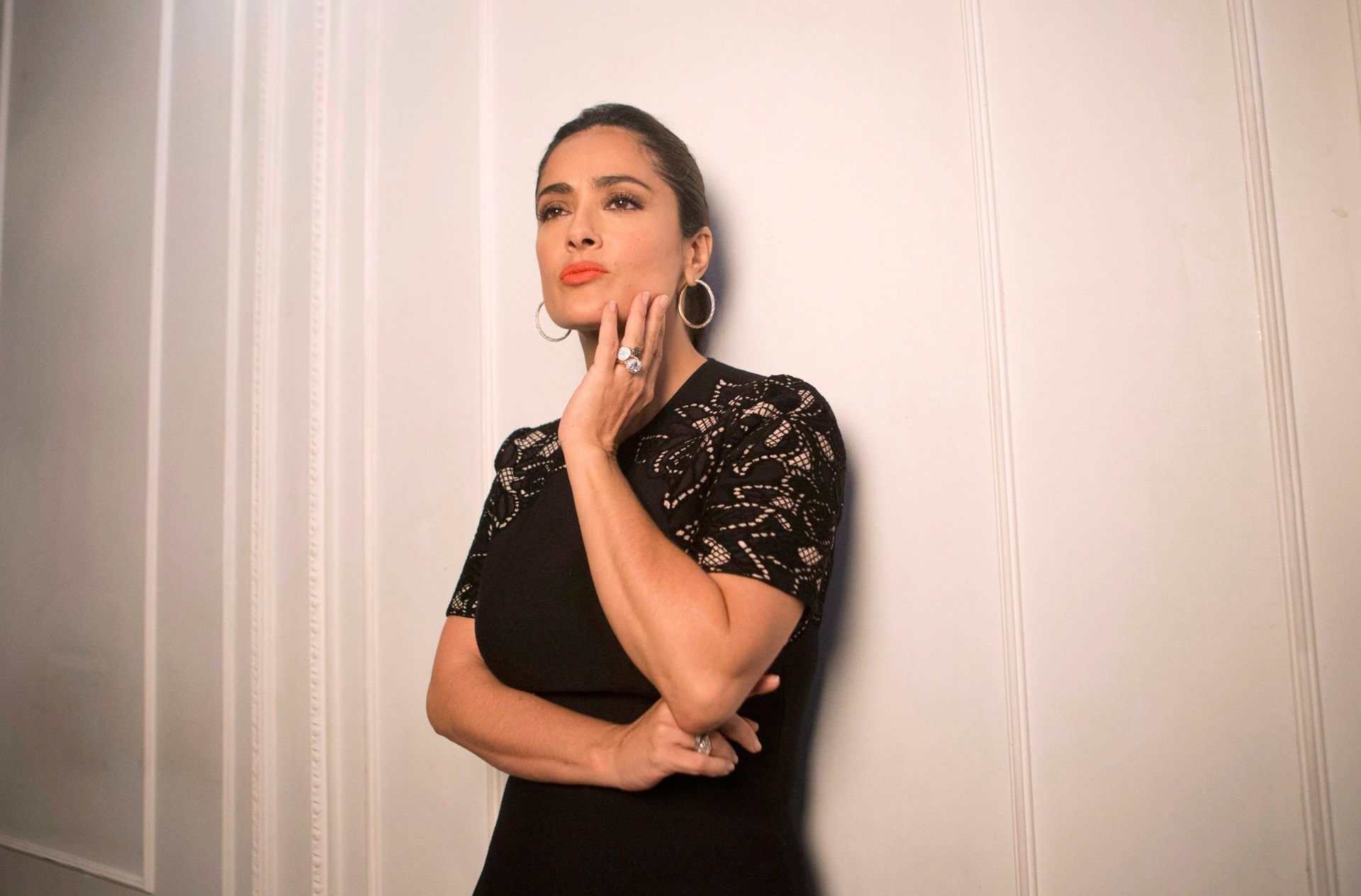 Salma Hayek posing against a white wall HD Wallpaper
