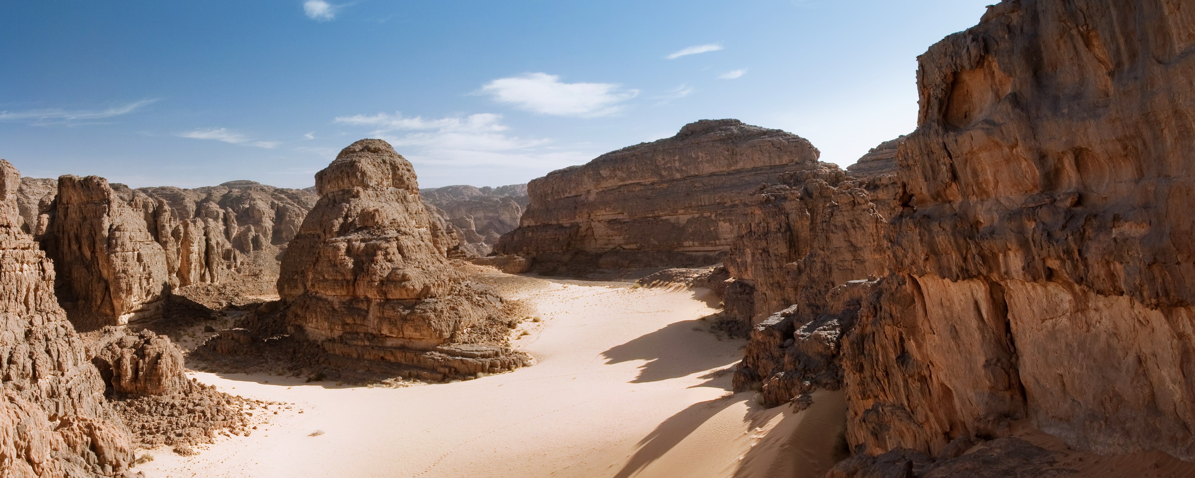 Desert landscape with rock formations and sand HD Wallpaper