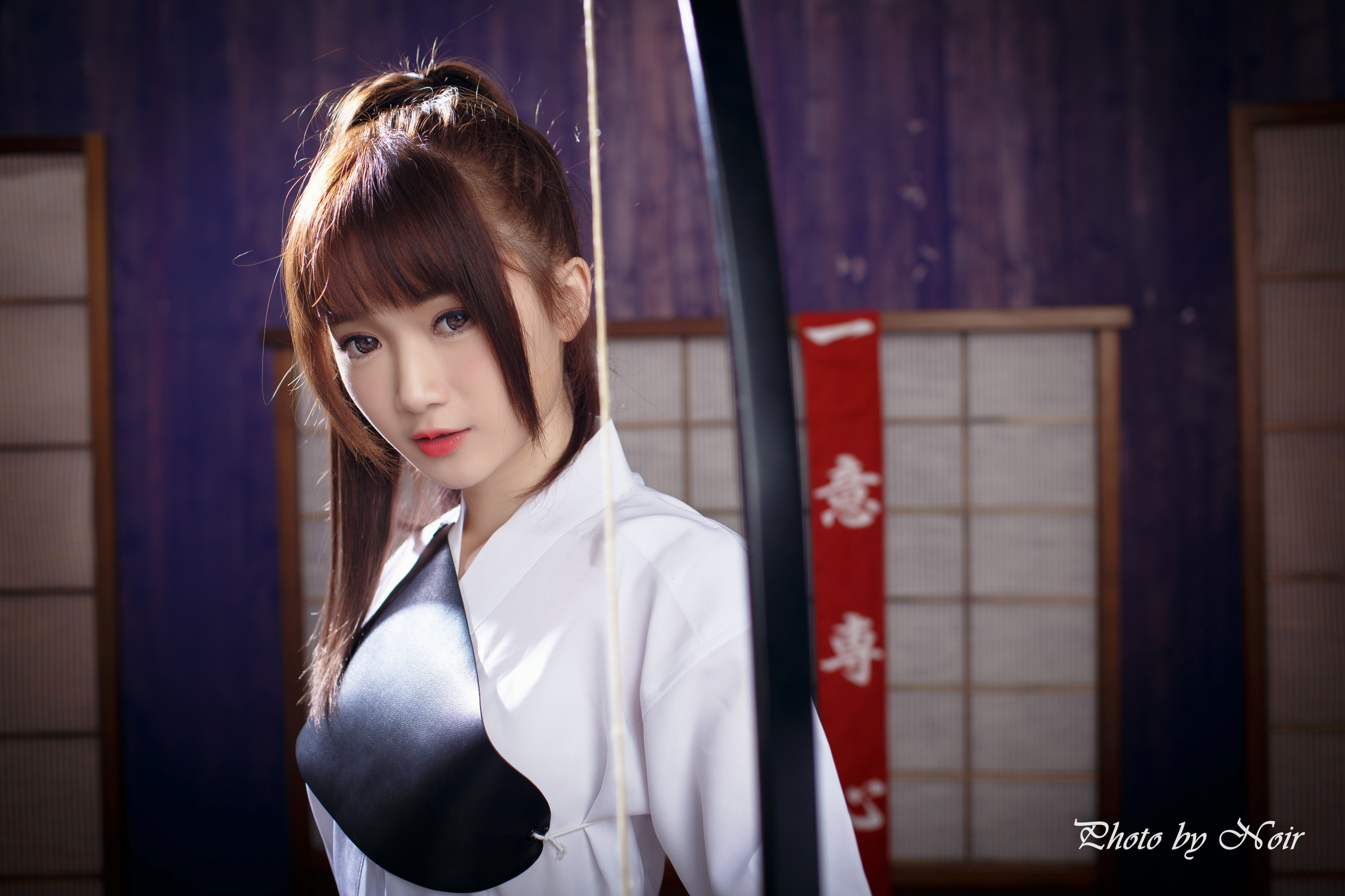 Asian woman in traditional Japanese archery attire HD Wallpaper