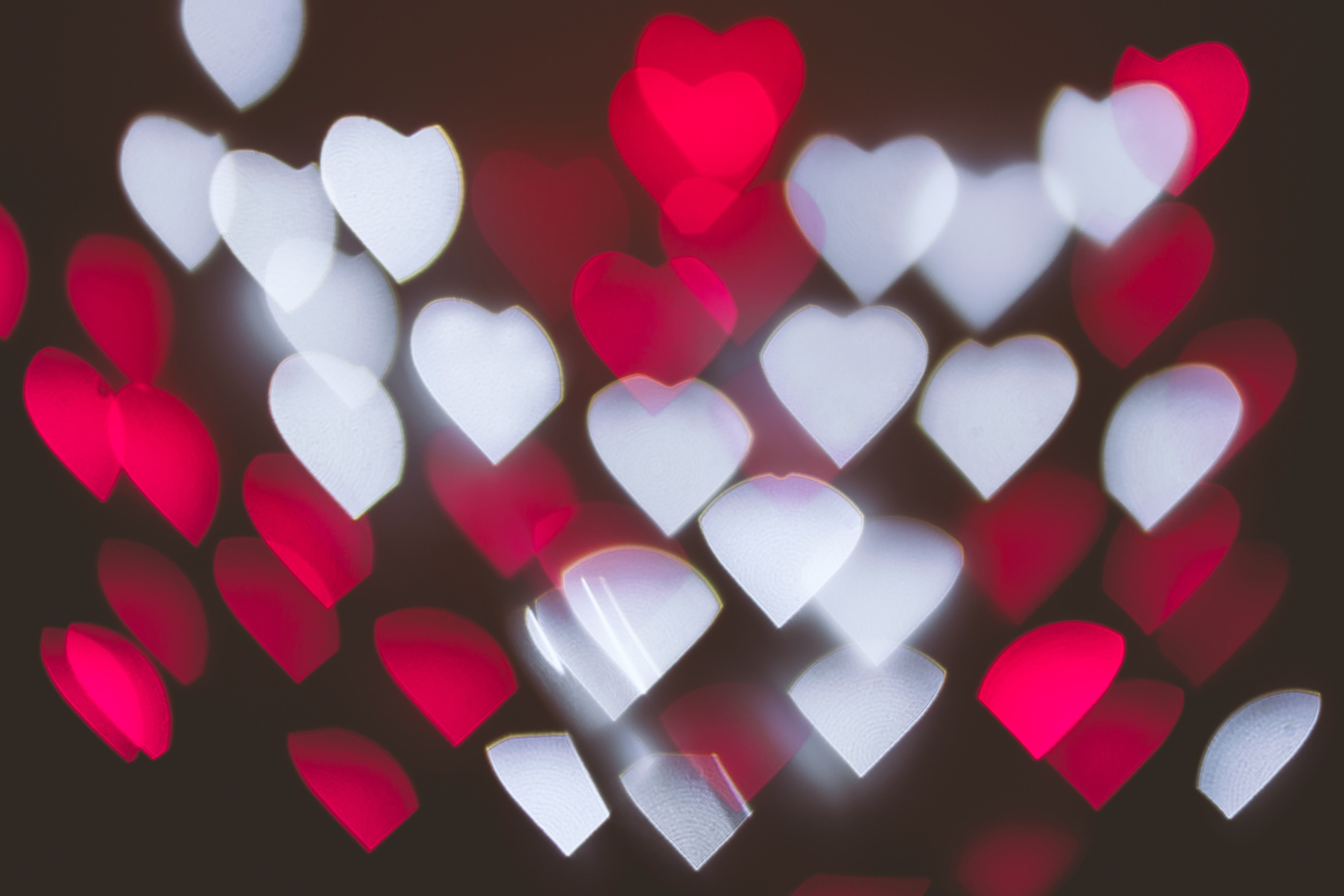 Heart-shaped bokeh lights in red and white HD Wallpaper