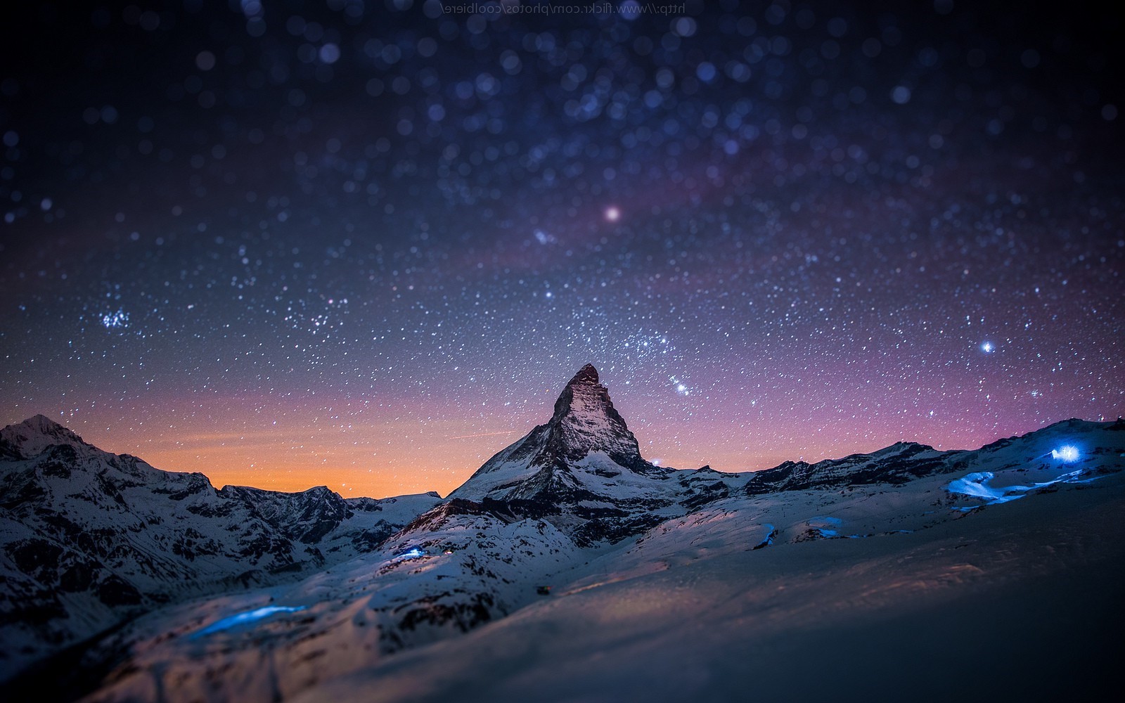 Matterhorn mountain under starry night sky in Switzerland HD Wallpaper