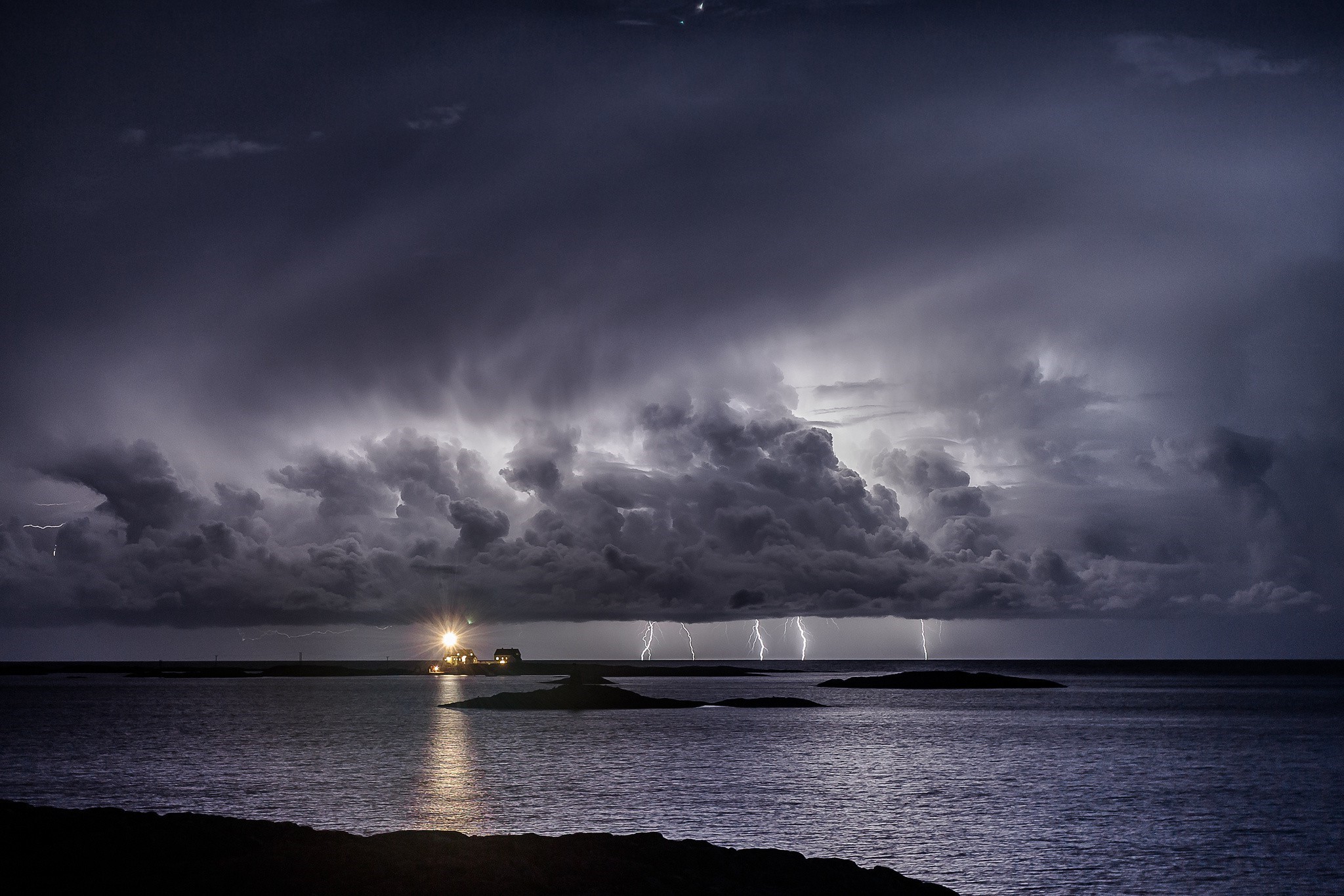 Lightning storm over the sea with a lighthouse HD Wallpaper