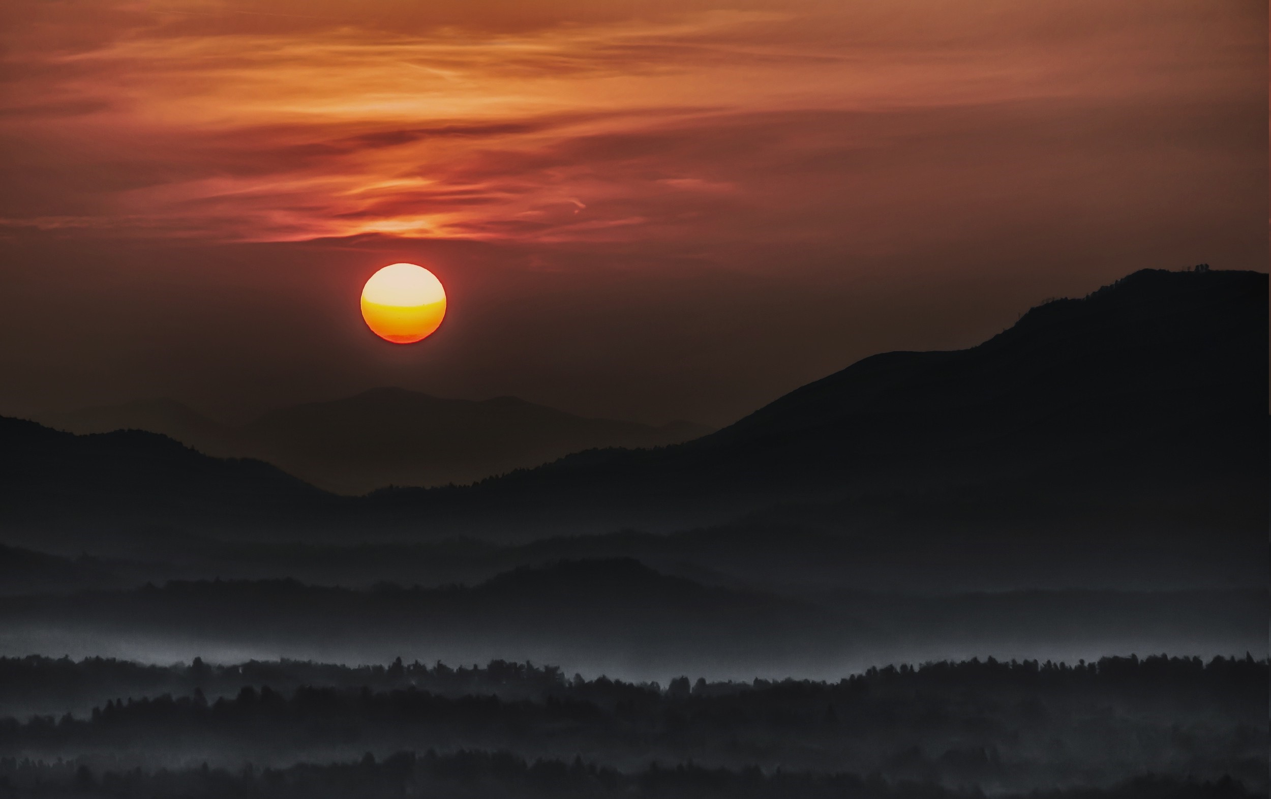 Sunset over misty mountains and forest HD Wallpaper