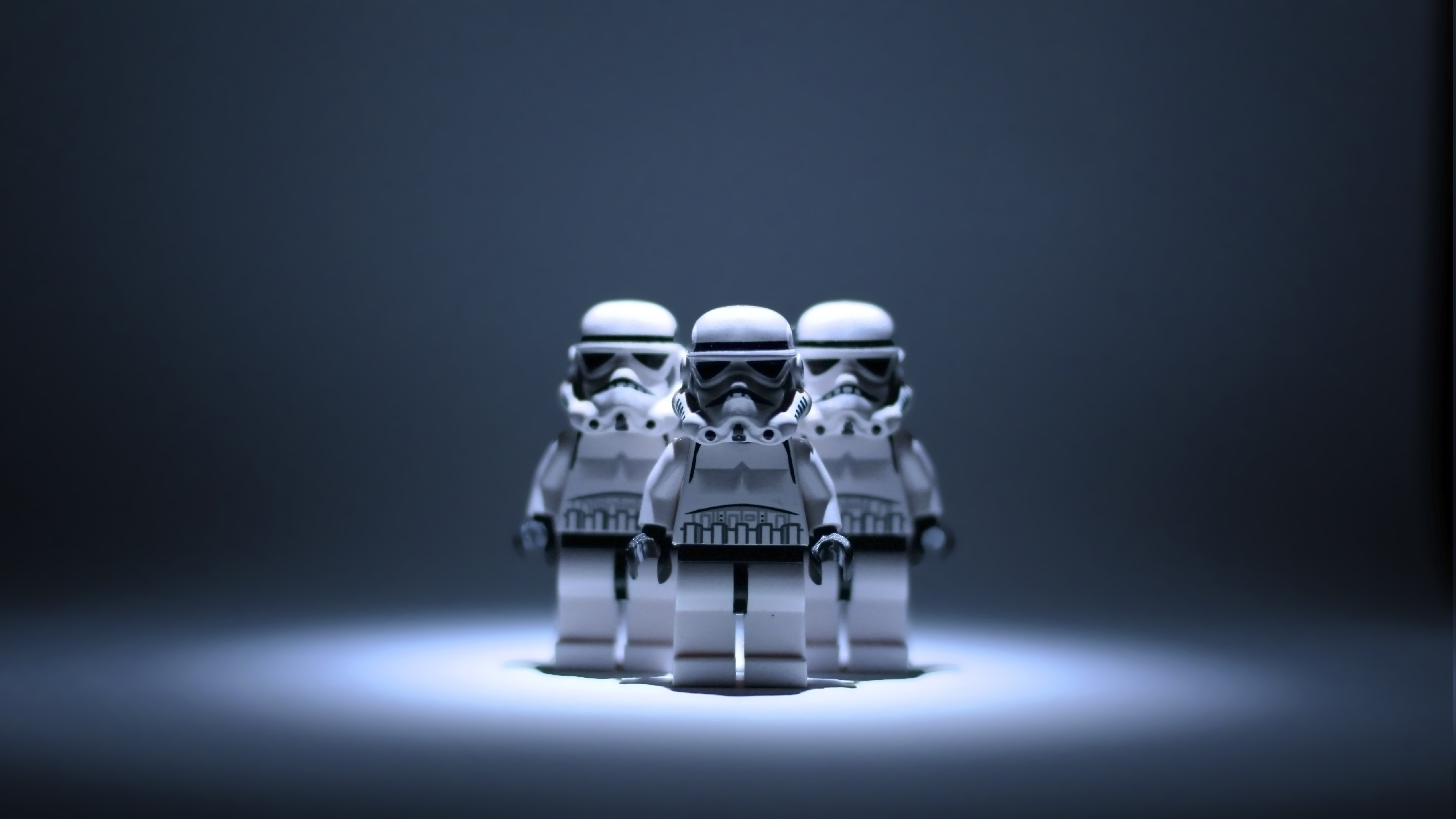 Three Lego Star Wars Stormtroopers in spotlight HD Wallpaper