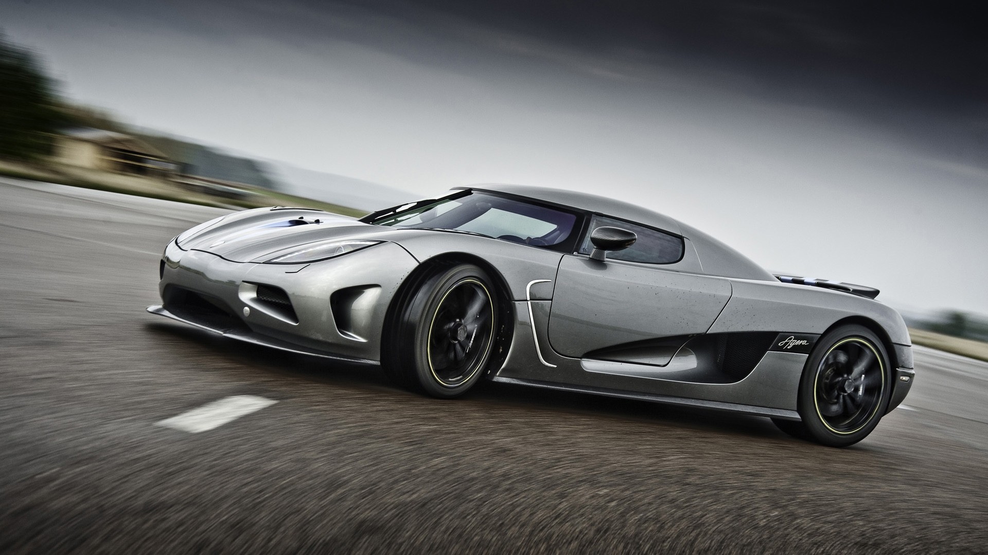 Koenigsegg Agera driving on a wet road HD Wallpaper